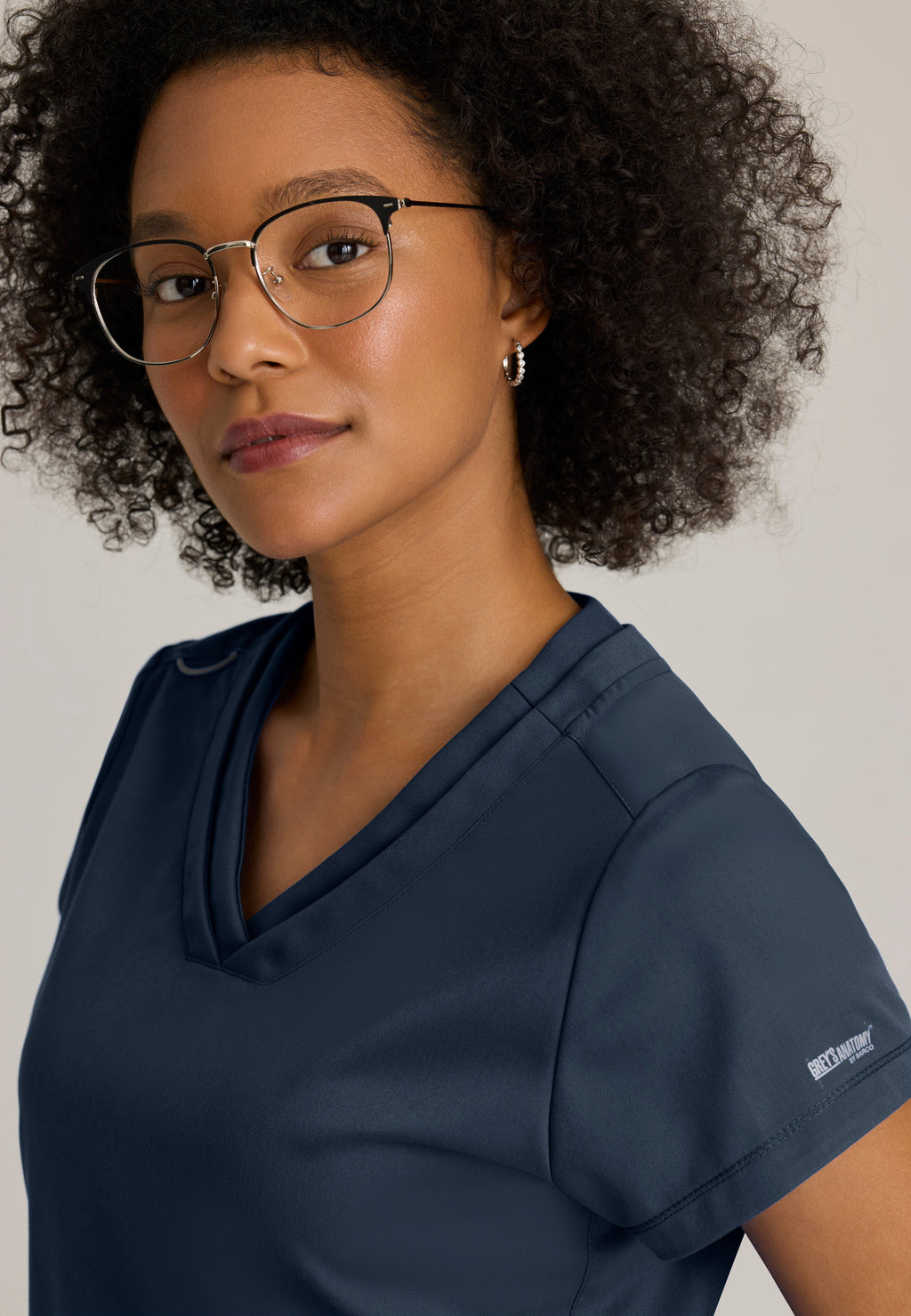Detail Shot of the Evelyn Pintuck Detail Scrub Top in Steel from Grey's Anatomy™ by Barco Classic