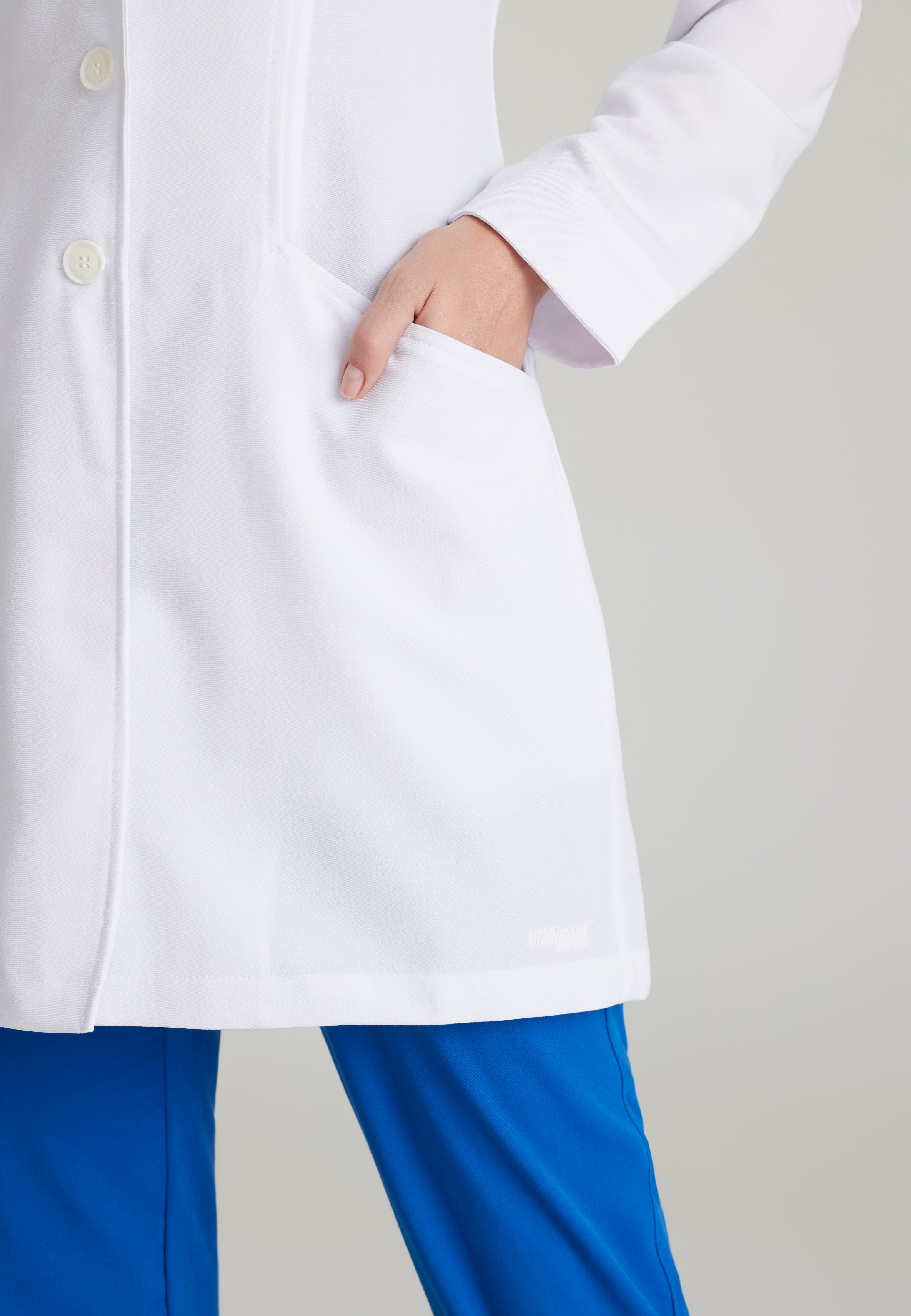 Detail Shot of the Eve 2-Pocket 34" Lab Coat in White from Grey's Anatomy™ by Barco Signature
