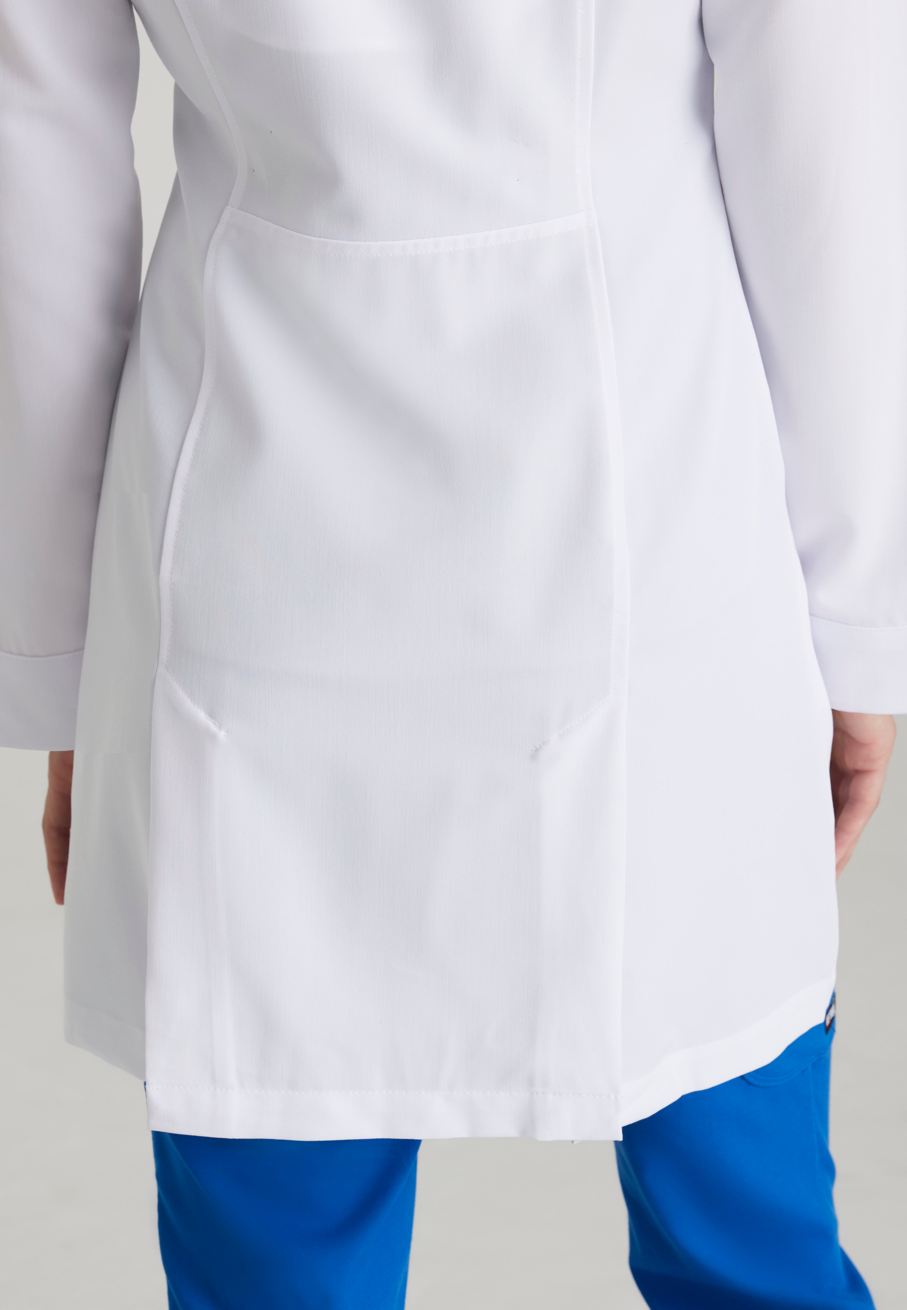 Detail Shot of the Eve 2-Pocket 34" Lab Coat in White from Grey's Anatomy™ by Barco Signature