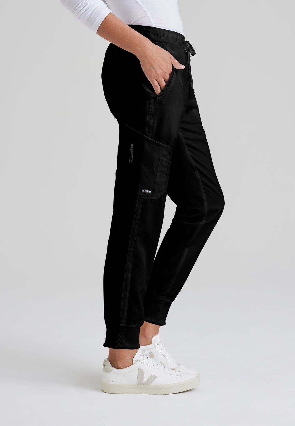 Side View of the Kira 5-Pocket Mid-Rise Jogger Scrub Pant in Black from Grey's Anatomy™ by Barco Classic