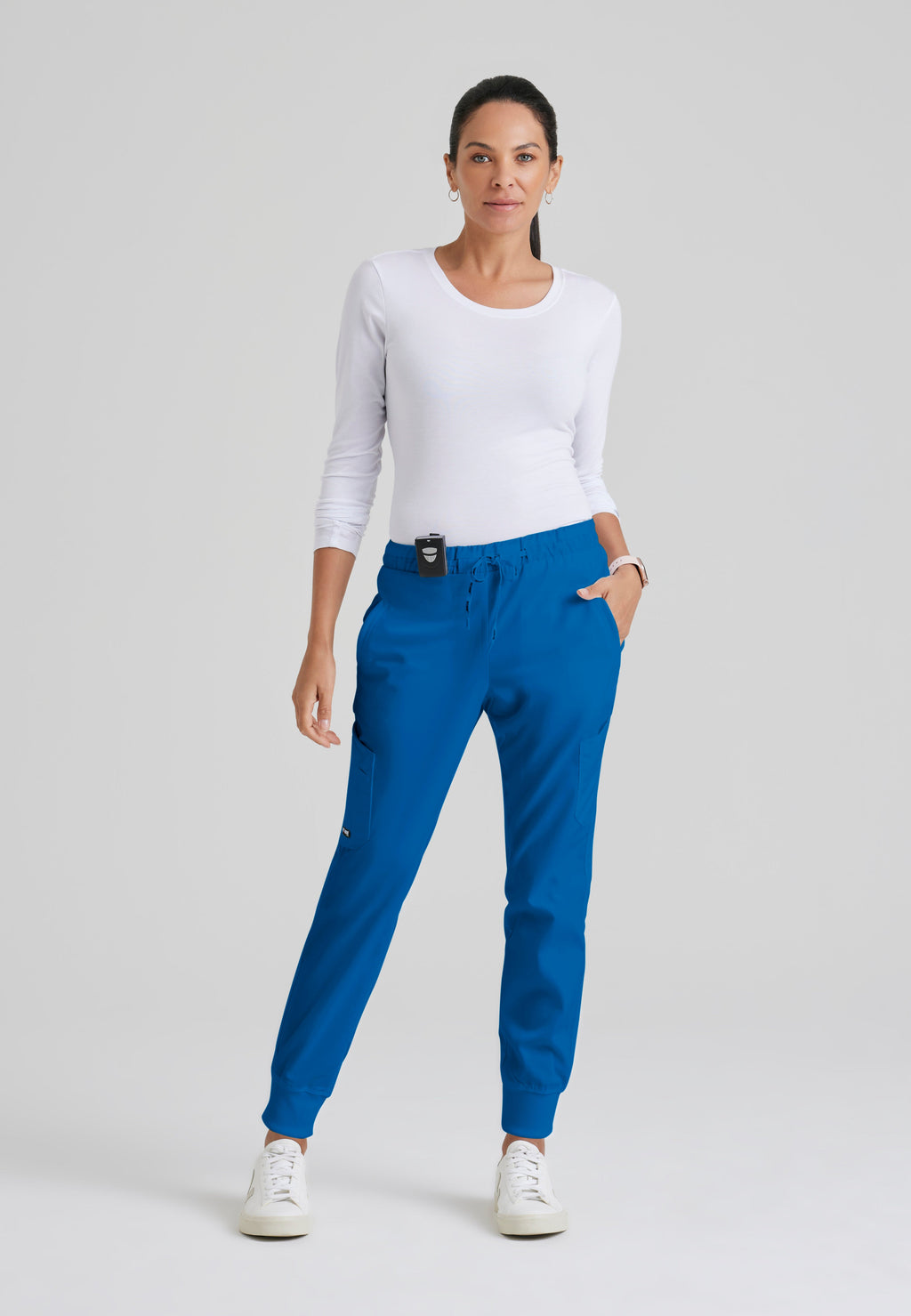 Full Body View of the Kira 5-Pocket Mid-Rise Jogger Scrub Pant in New Royal from Grey's Anatomy™ by Barco Classic