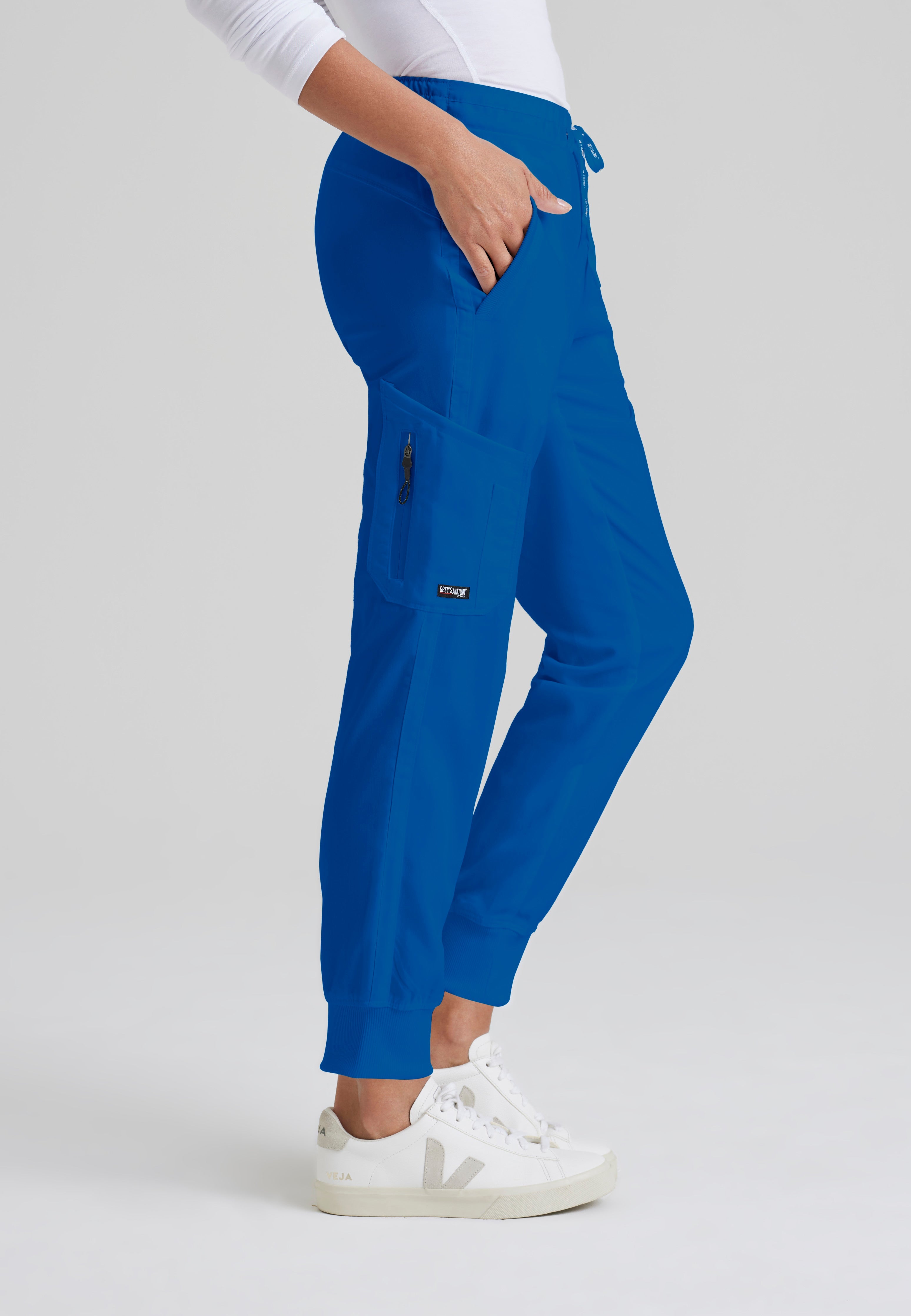 Side View of the Kira 5-Pocket Mid-Rise Jogger Scrub Pant in New Royal from Grey's Anatomy™ by Barco Classic
