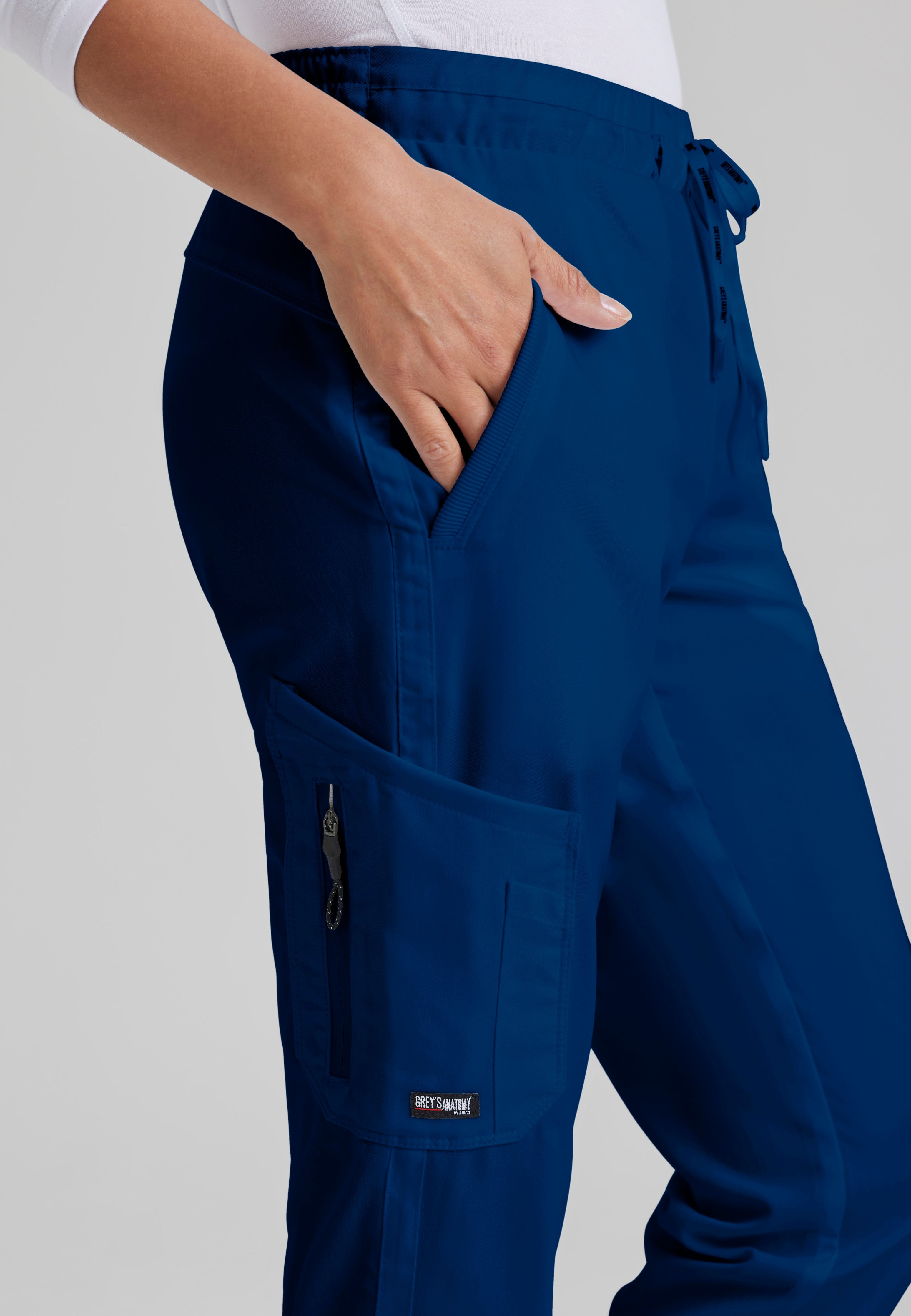 Detail Shot of the Kira 5-Pocket Mid-Rise Jogger Scrub Pant in Indigo from Grey's Anatomy™ by Barco Classic