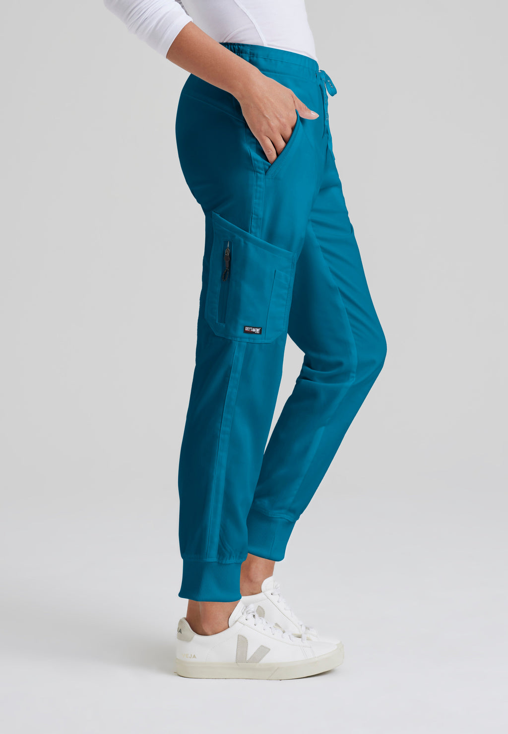 Side View of the Kira 5-Pocket Mid-Rise Jogger Scrub Pant in Bahama from Grey's Anatomy™ by Barco Classic