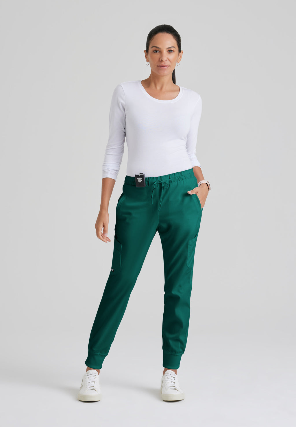 Full Body View of the Kira 5-Pocket Mid-Rise Jogger Scrub Pant in Hunter Green from Grey's Anatomy™ by Barco Classic