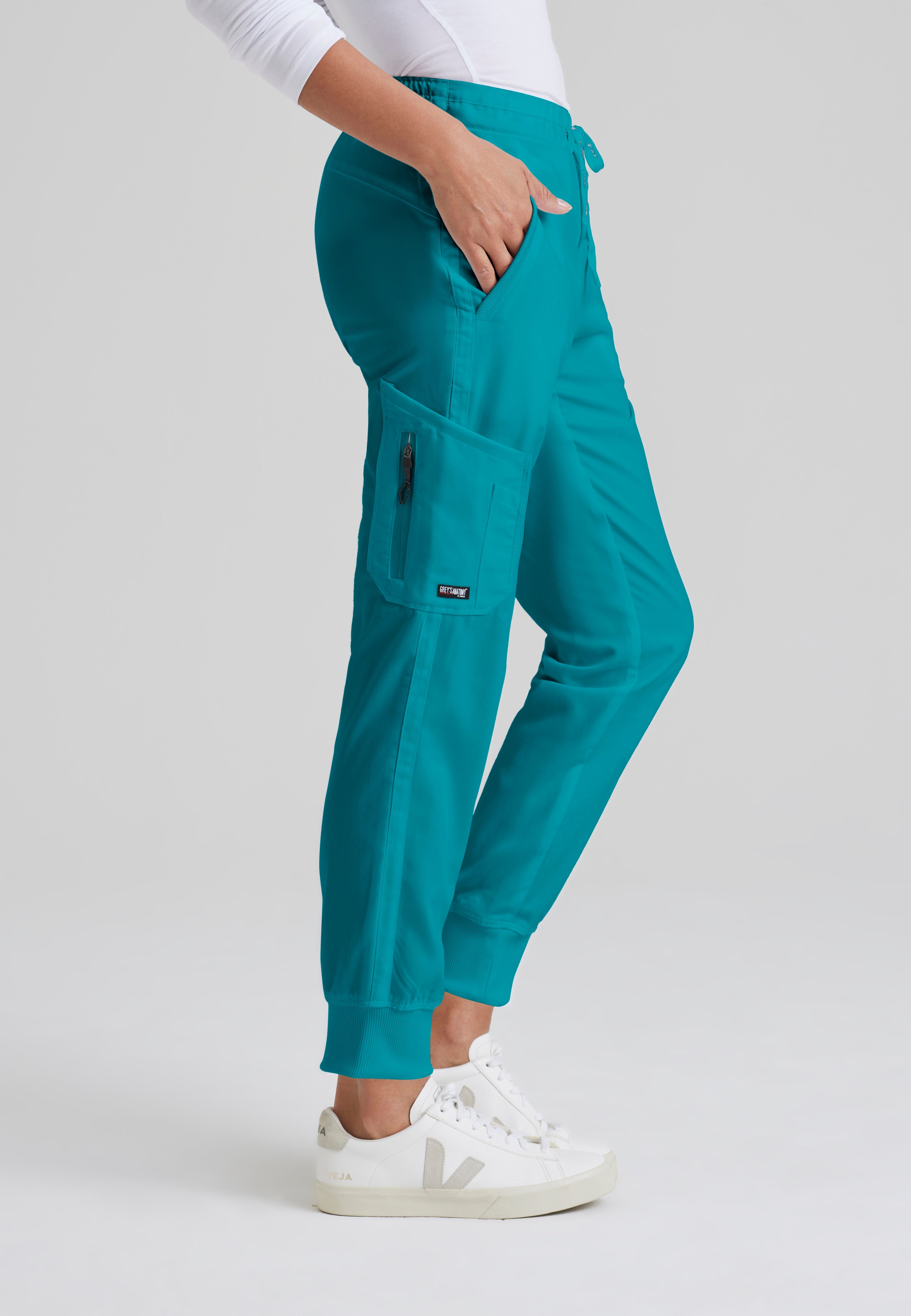 Side View of the Kira 5-Pocket Mid-Rise Jogger Scrub Pant in Teal from Grey's Anatomy™ by Barco Classic