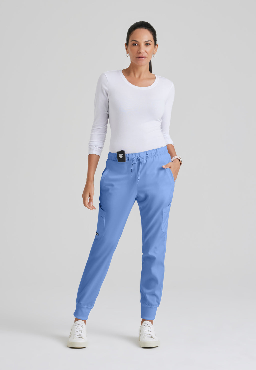 Full Body View of the Kira 5-Pocket Mid-Rise Jogger Scrub Pant in Ciel Blue from Grey's Anatomy™ by Barco Classic