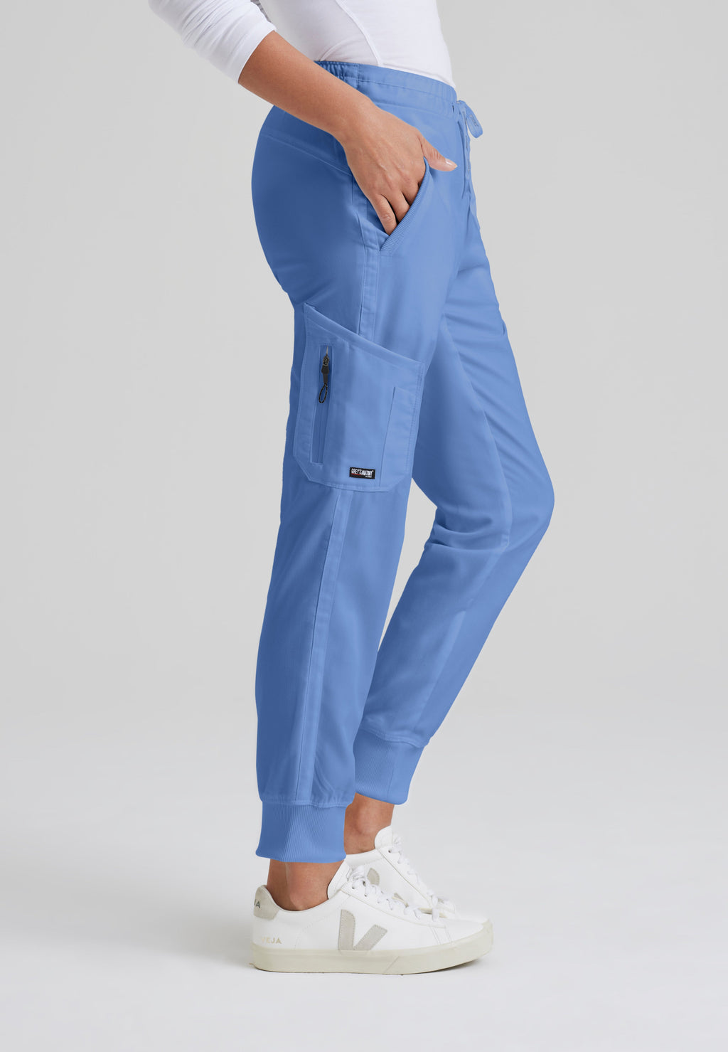 Side View of the Kira 5-Pocket Mid-Rise Jogger Scrub Pant in Ciel Blue from Grey's Anatomy™ by Barco Classic
