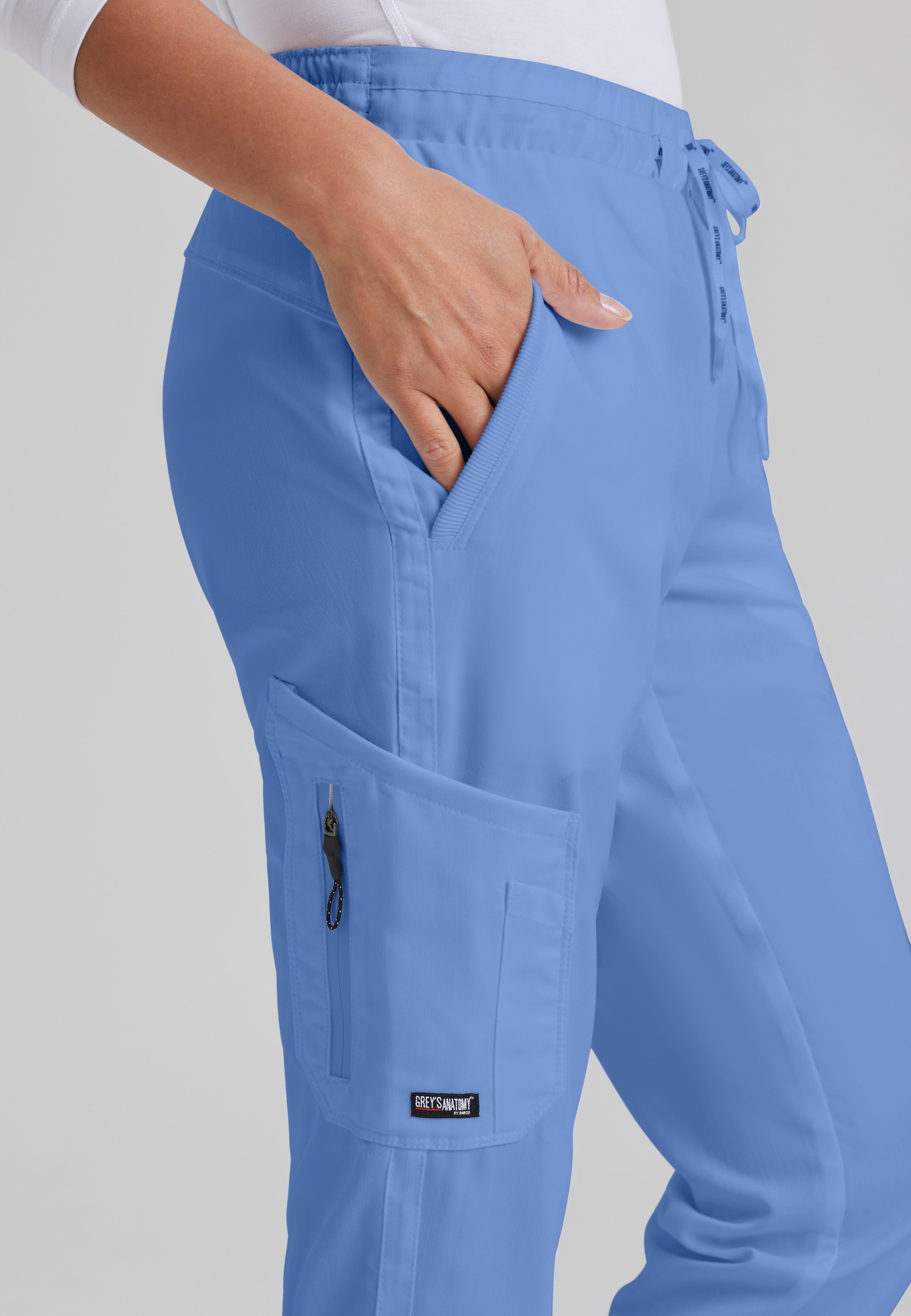 Detail Shot of the Kira 5-Pocket Mid-Rise Jogger Scrub Pant in Ciel Blue from Grey's Anatomy™ by Barco Classic