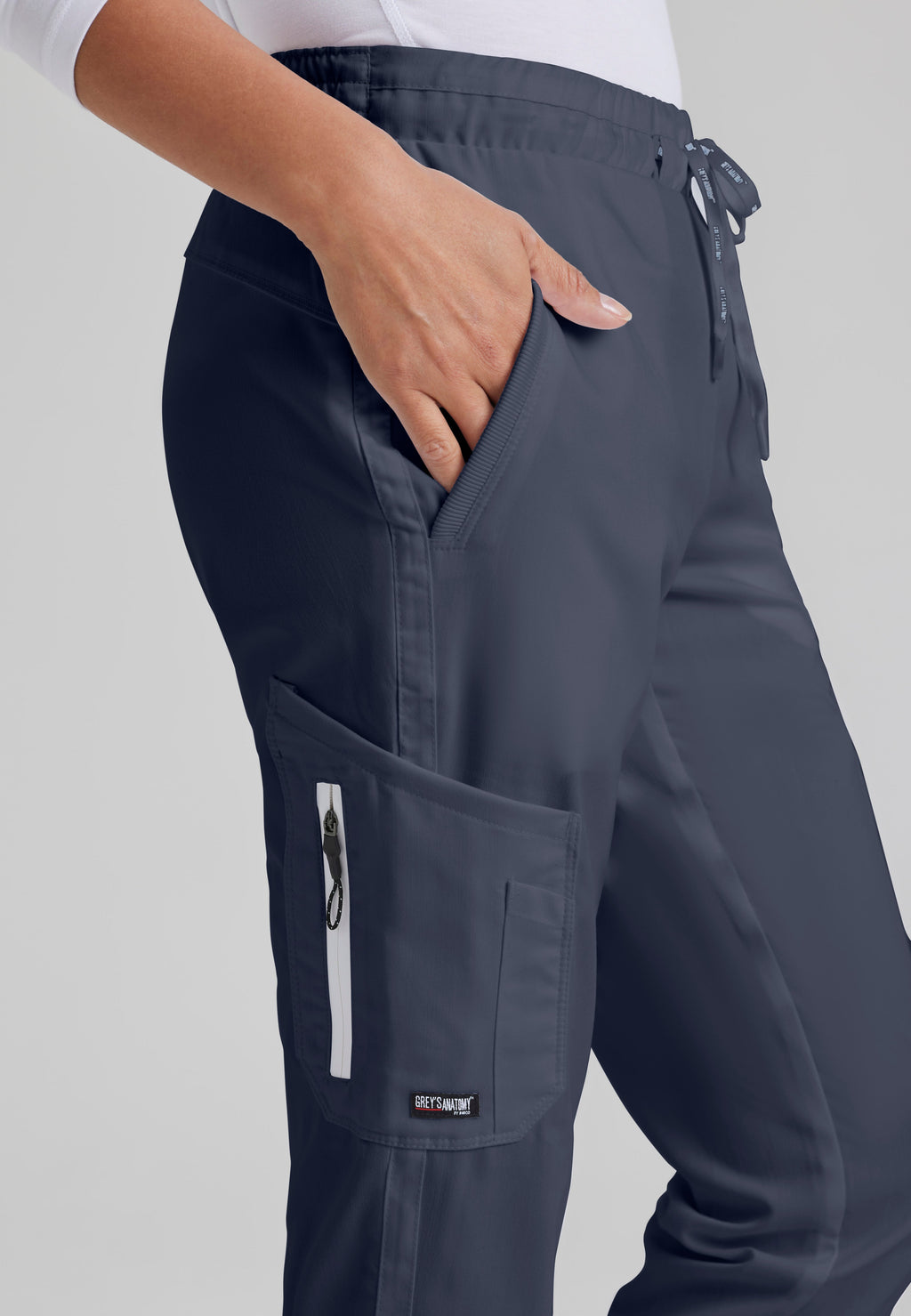 Detail Shot of the Kira 5-Pocket Mid-Rise Jogger Scrub Pant in Steel from Grey's Anatomy™ by Barco Classic