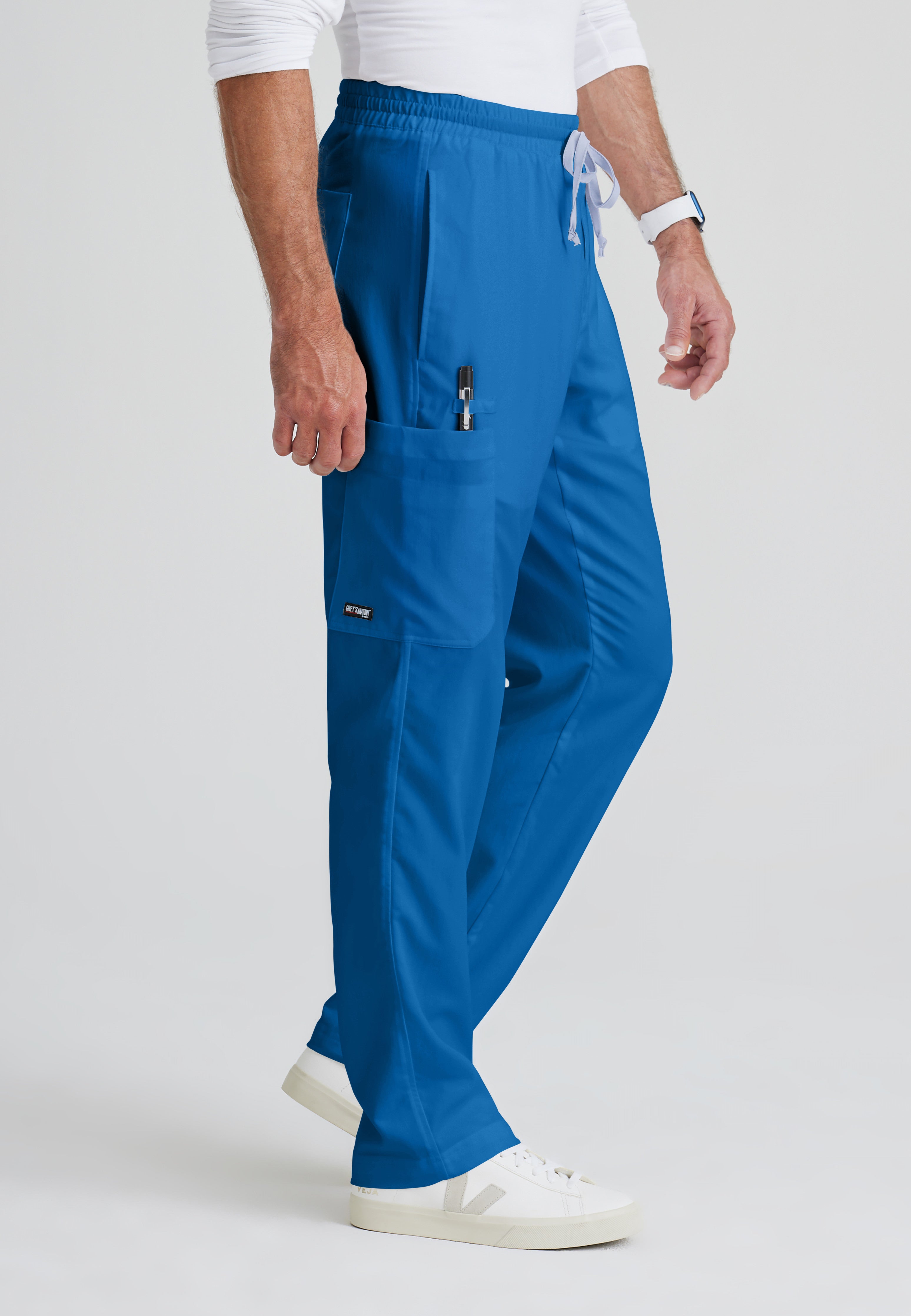 Side View of the Evan 5-Pocket Zip-Fly Scrub Pant in New Royal from Grey's Anatomy™ by Barco Classic