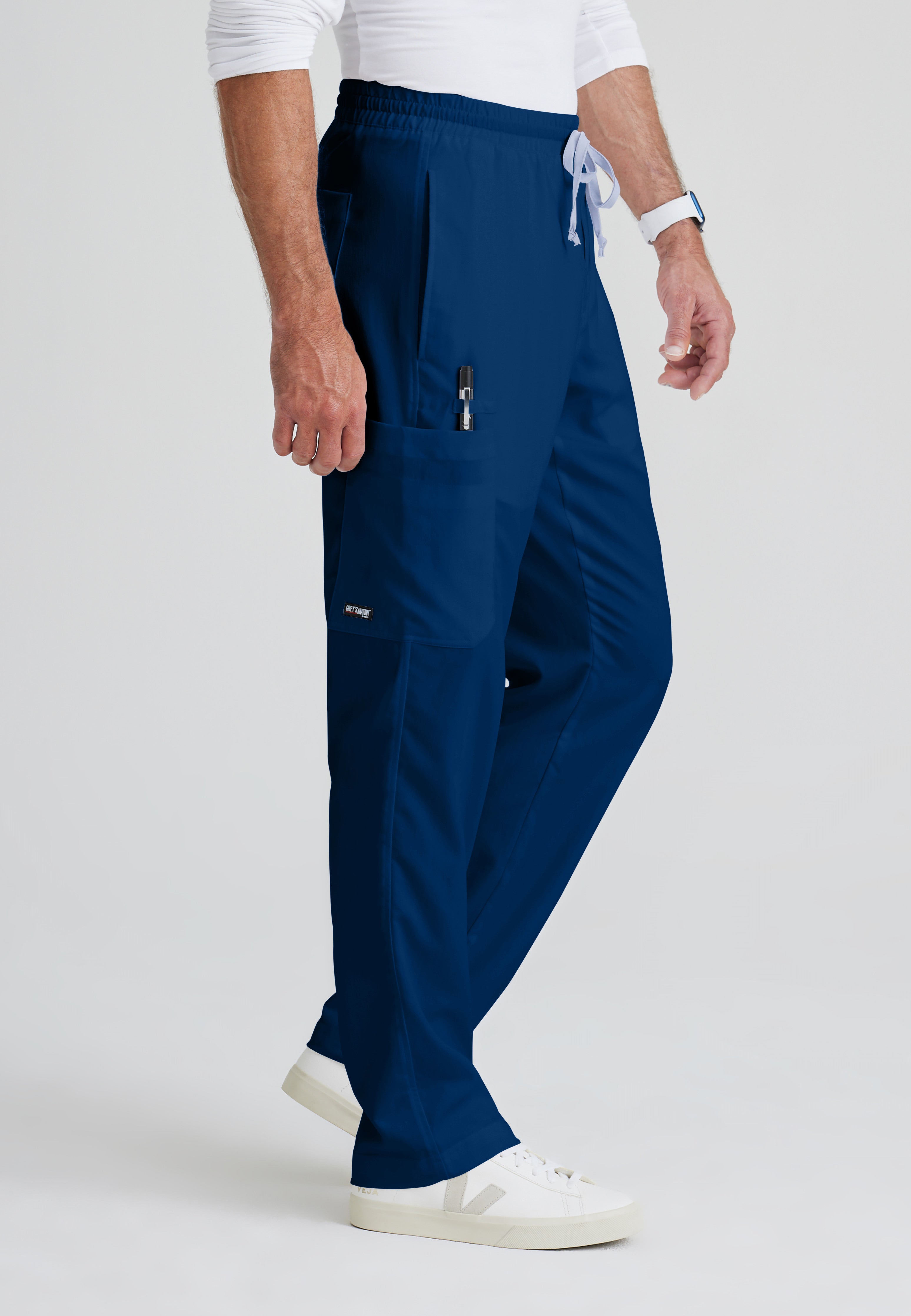Side View of the Evan 5-Pocket Zip-Fly Scrub Pant in Indigo from Grey's Anatomy™ by Barco Classic