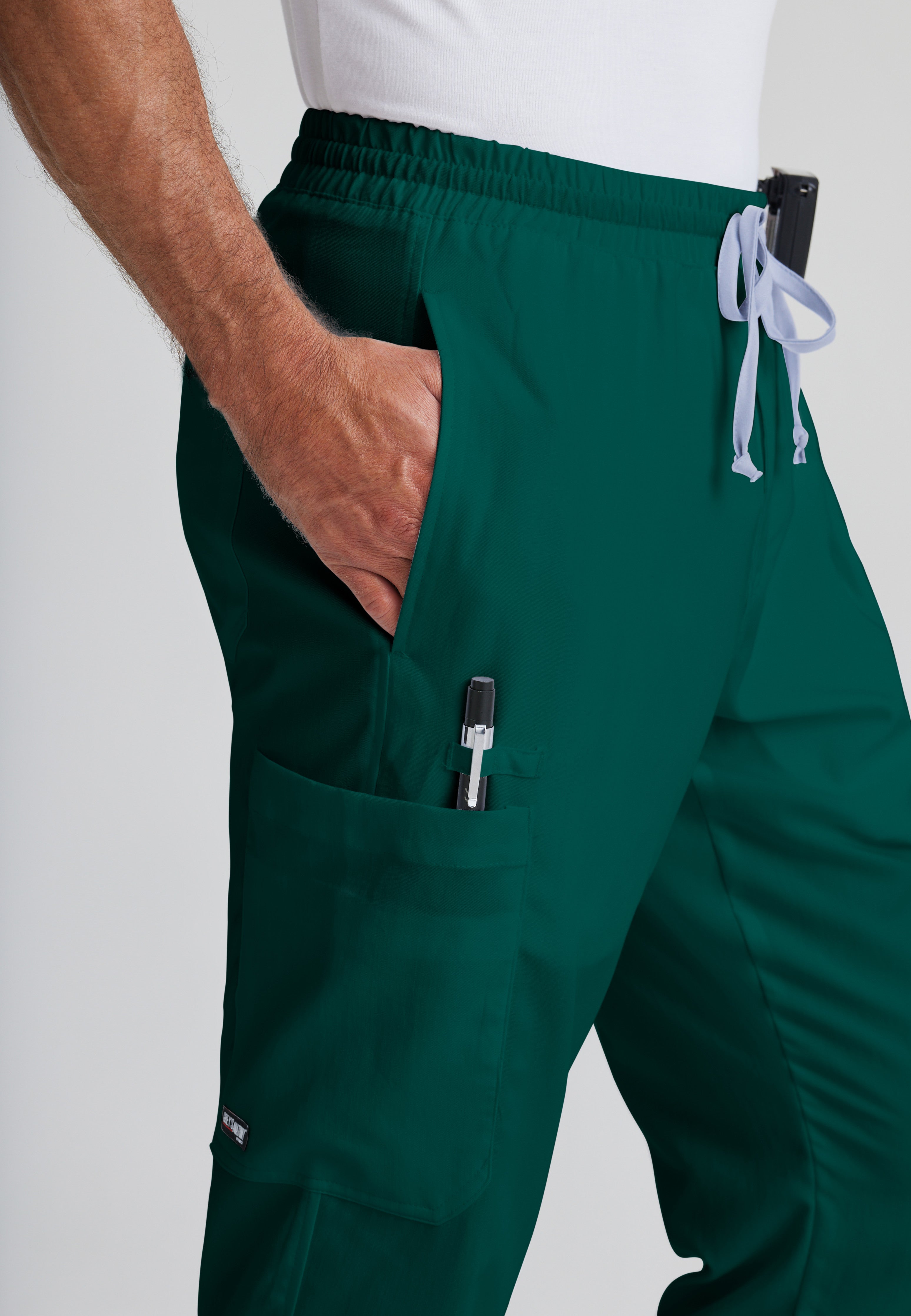 Detail Shot of the Evan 5-Pocket Zip-Fly Scrub Pant in Hunter Green from Grey's Anatomy™ by Barco Classic