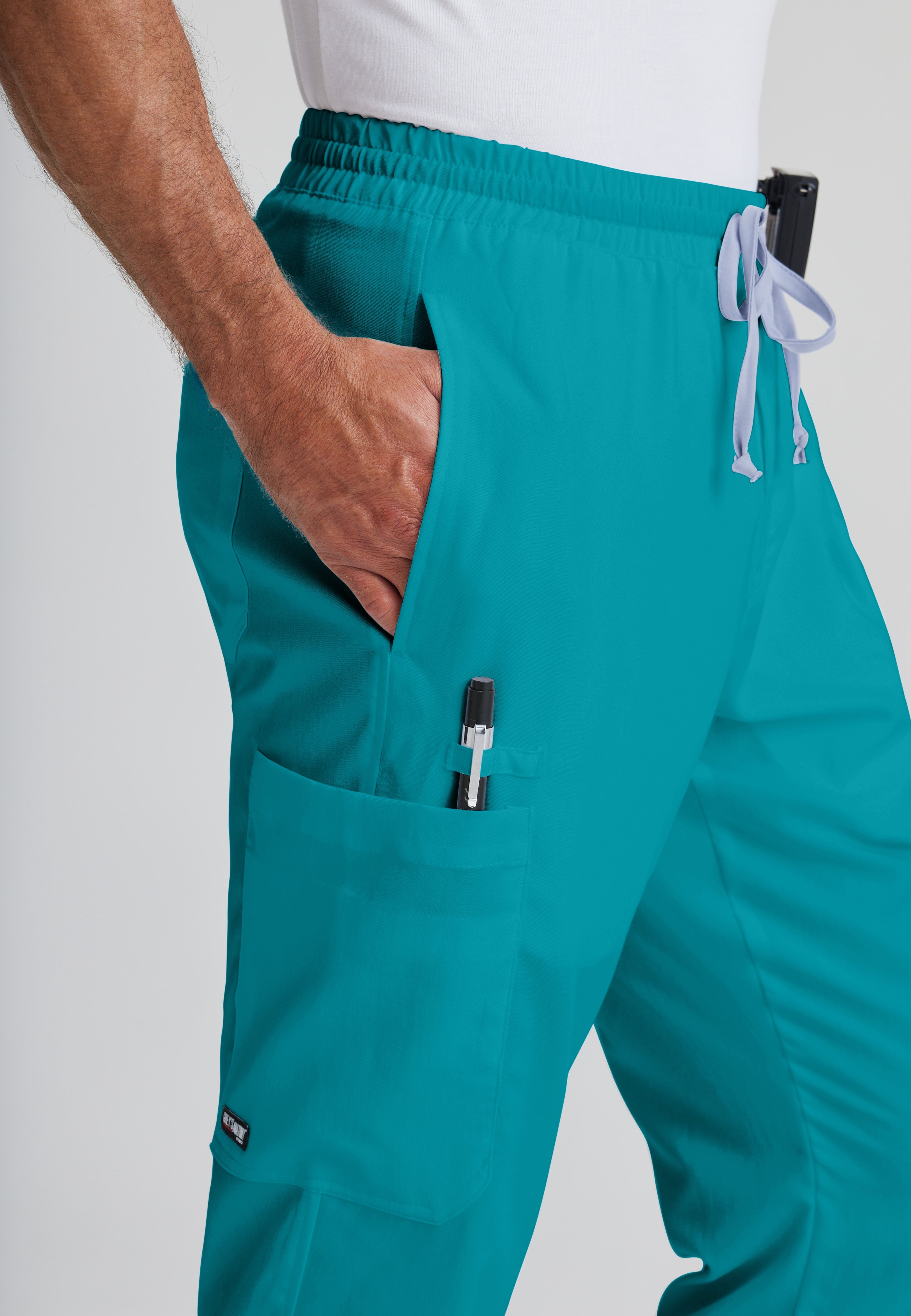 Detail Shot of the Evan 5-Pocket Zip-Fly Scrub Pant in Teal from Grey's Anatomy™ by Barco Classic