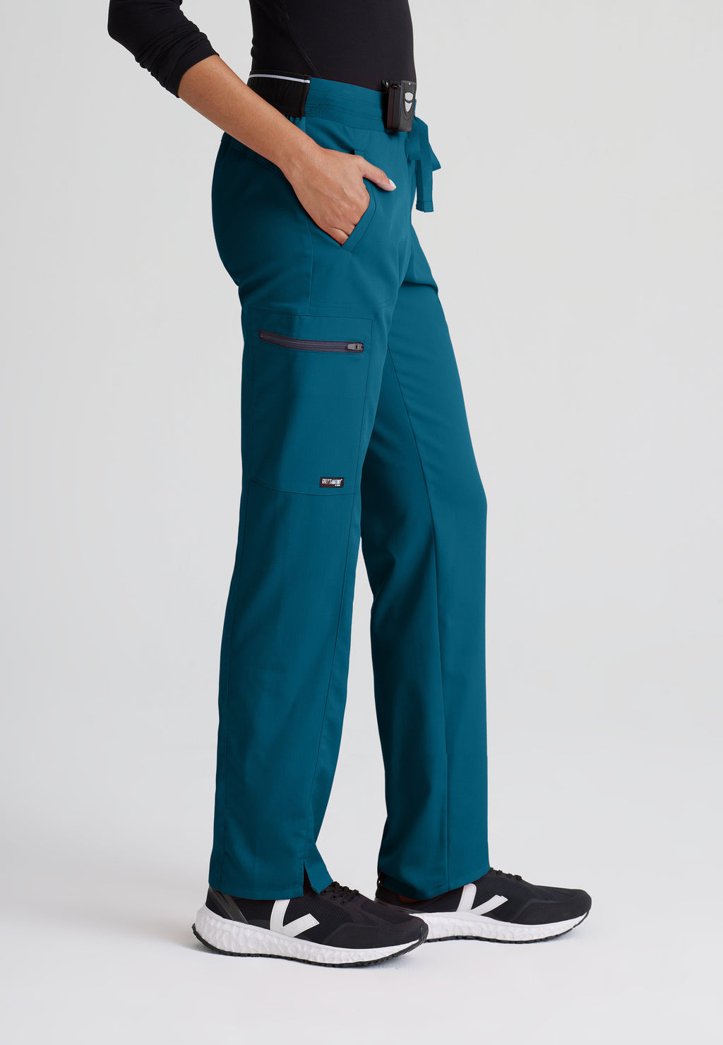 Side View of the Kim 3-Pocket Mid-Rise Straight Leg Scrub Pant in Bahama from Grey's Anatomy™ by Barco Spandex Stretch