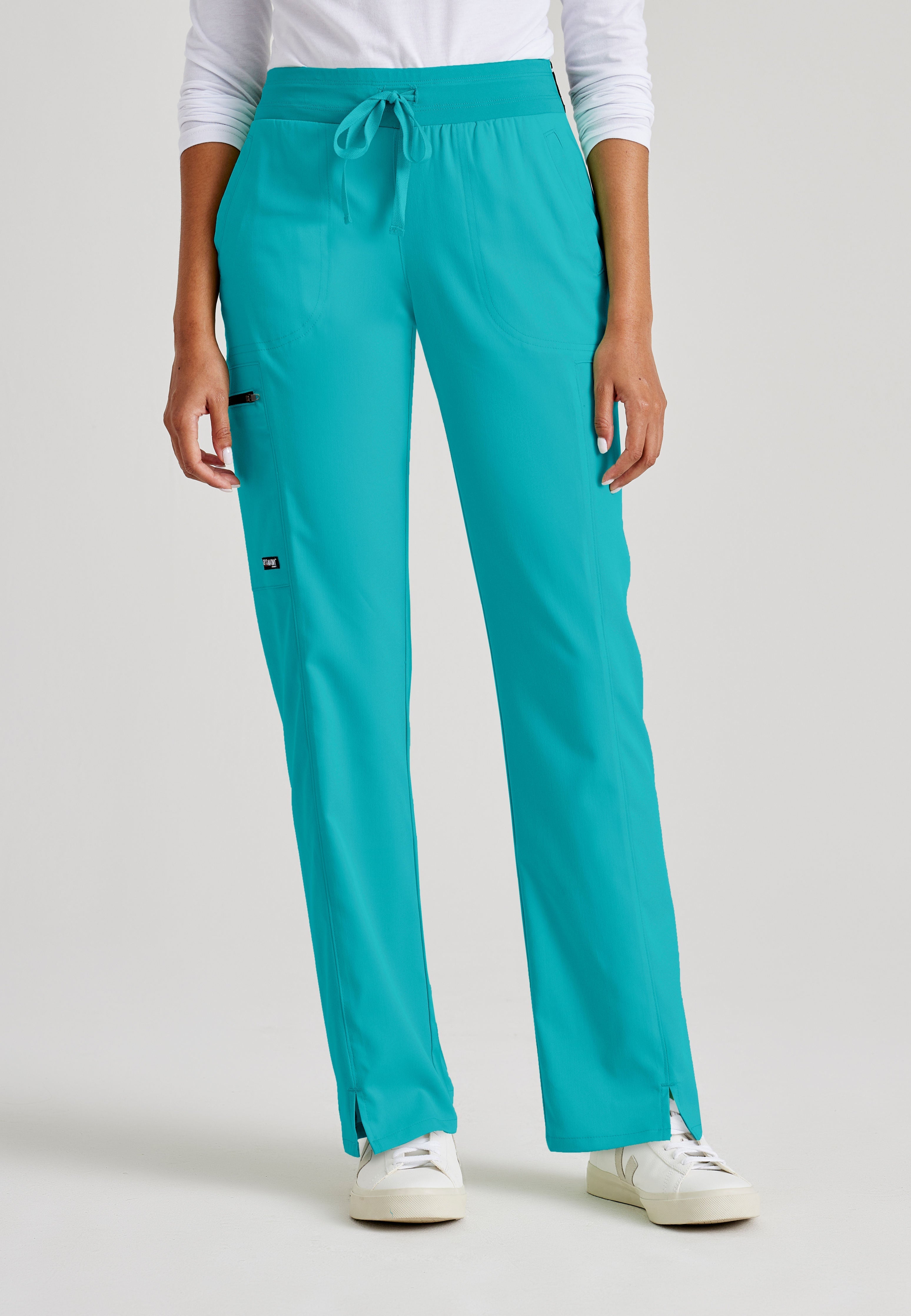 Grey's Anatomy Spandex-Stretch Kim scrub Pants in teal - Straight leg. Mid rise. 3 pockets. Soft touch moisture wicking fabric. 