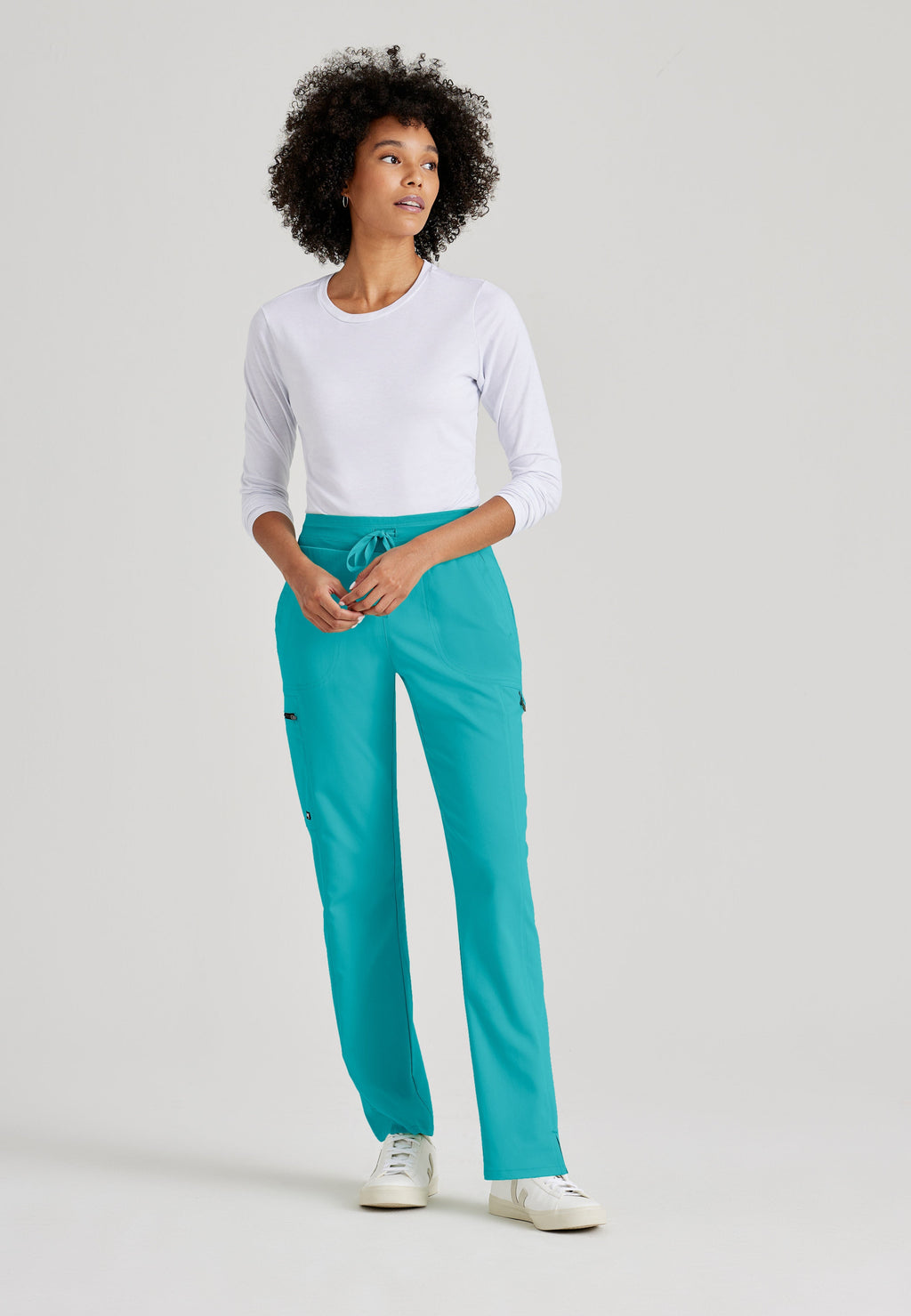 Grey's Anatomy Spandex-Stretch Kim scrub Pants in teal - Straight leg. Mid rise. 3 pockets. Soft touch moisture wicking fabric. 