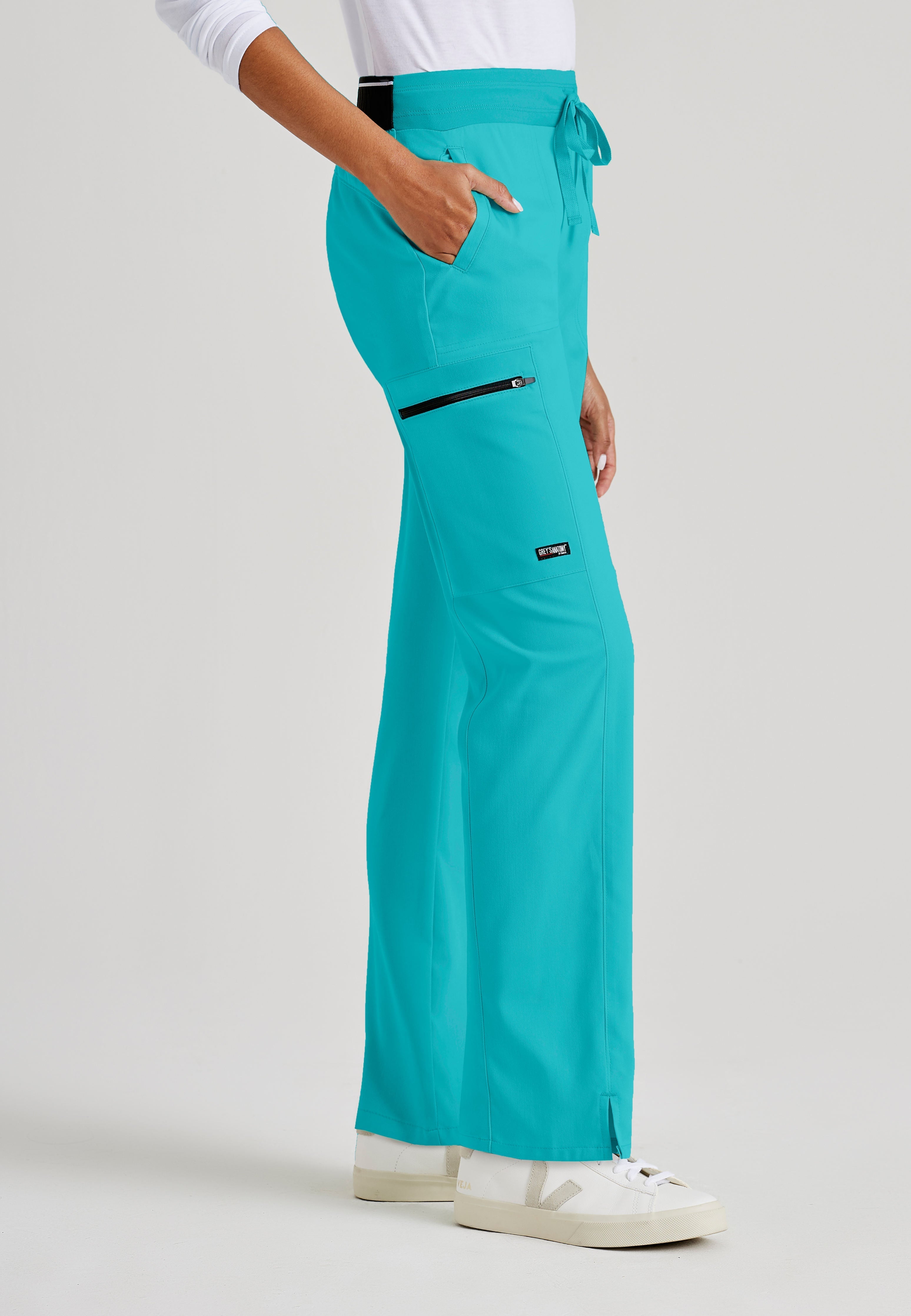 Grey's Anatomy Spandex-Stretch Kim scrub Pants in teal - Straight leg. Mid rise. 3 pockets. Soft touch moisture wicking fabric. 