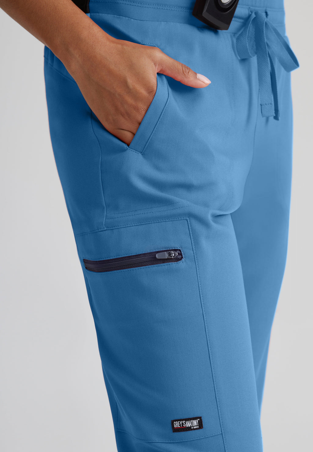 Detail Shot of the Kim 3-Pocket Mid-Rise Straight Leg Scrub Pant in Ciel Blue from Grey's Anatomy™ by Barco Spandex Stretch