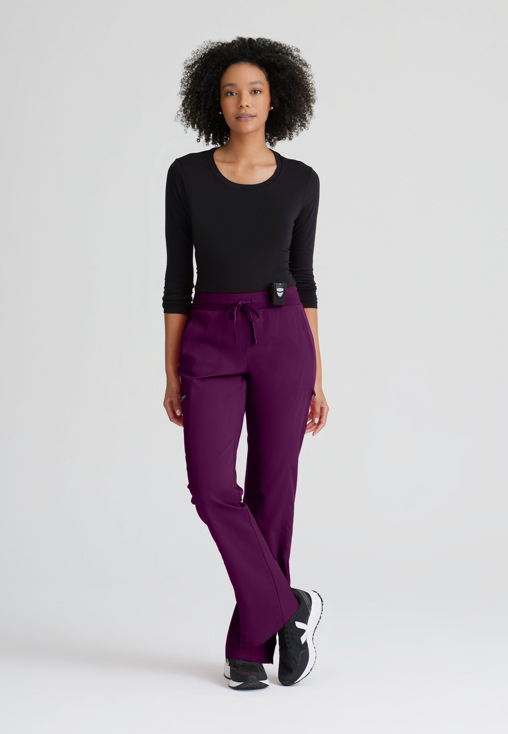 Full Body View of the Kim 3-Pocket Mid-Rise Straight Leg Scrub Pant in Wine from Grey's Anatomy™ by Barco Spandex Stretch