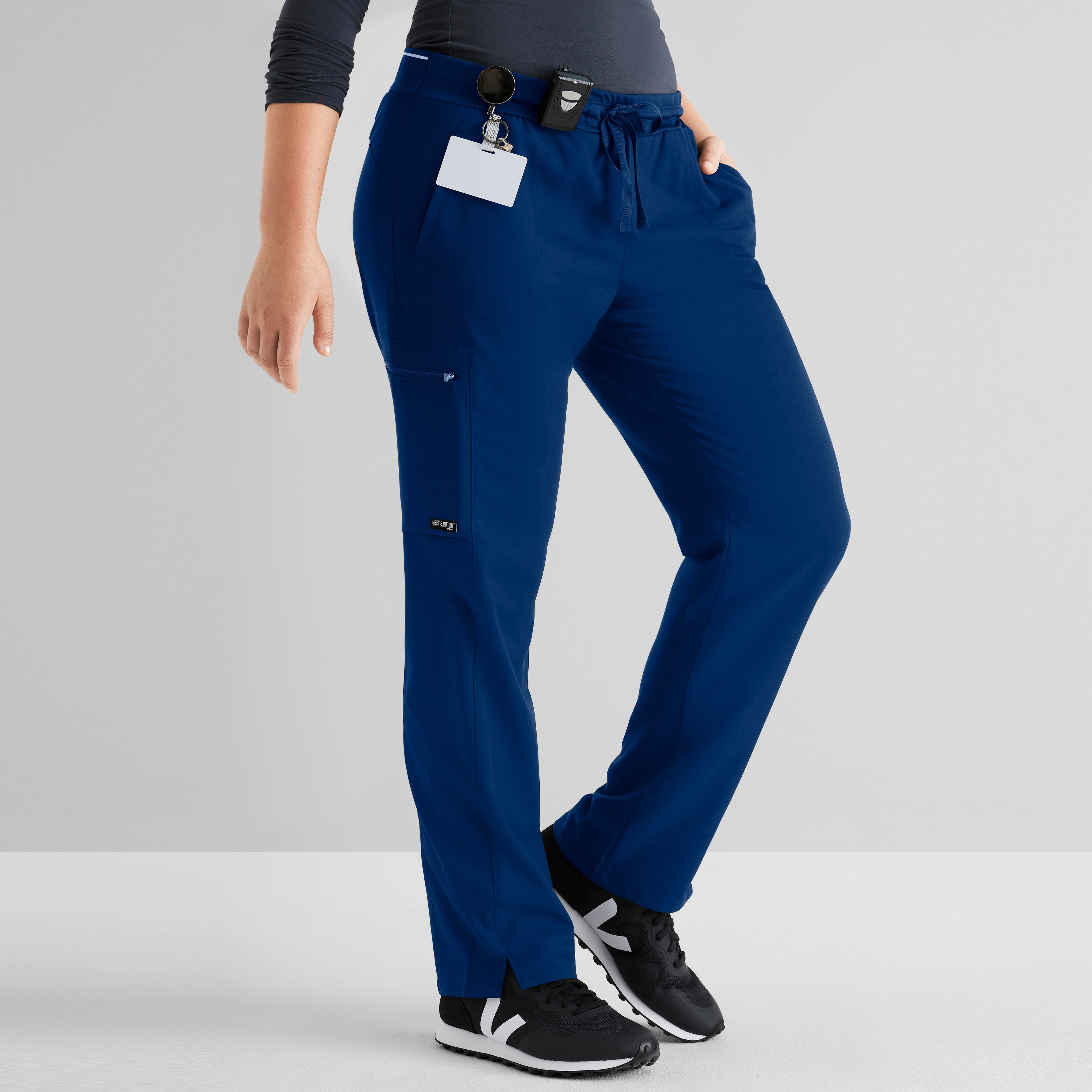 Grey's Anatomy Spandex-Stretch Kim scrub Pants in indigo - Straight leg. Mid rise. 3 pockets. Soft touch moisture wicking fabric. 
