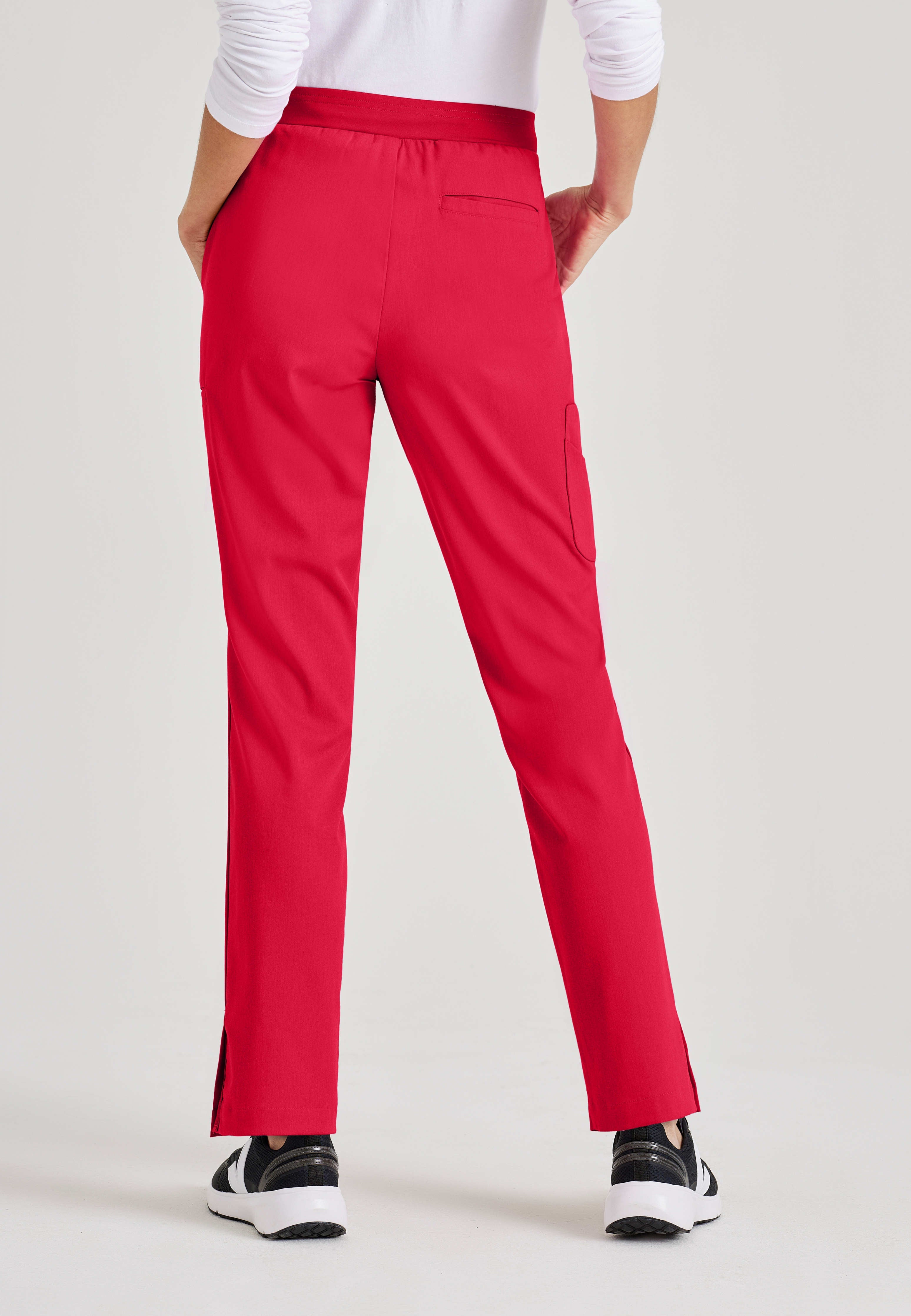 Back View of the Serena 7-Pocket Mid-Rise Tappered Leg Scrub Pant in Scarlet Red from Grey's Anatomy™ by Barco Spandex Stretch