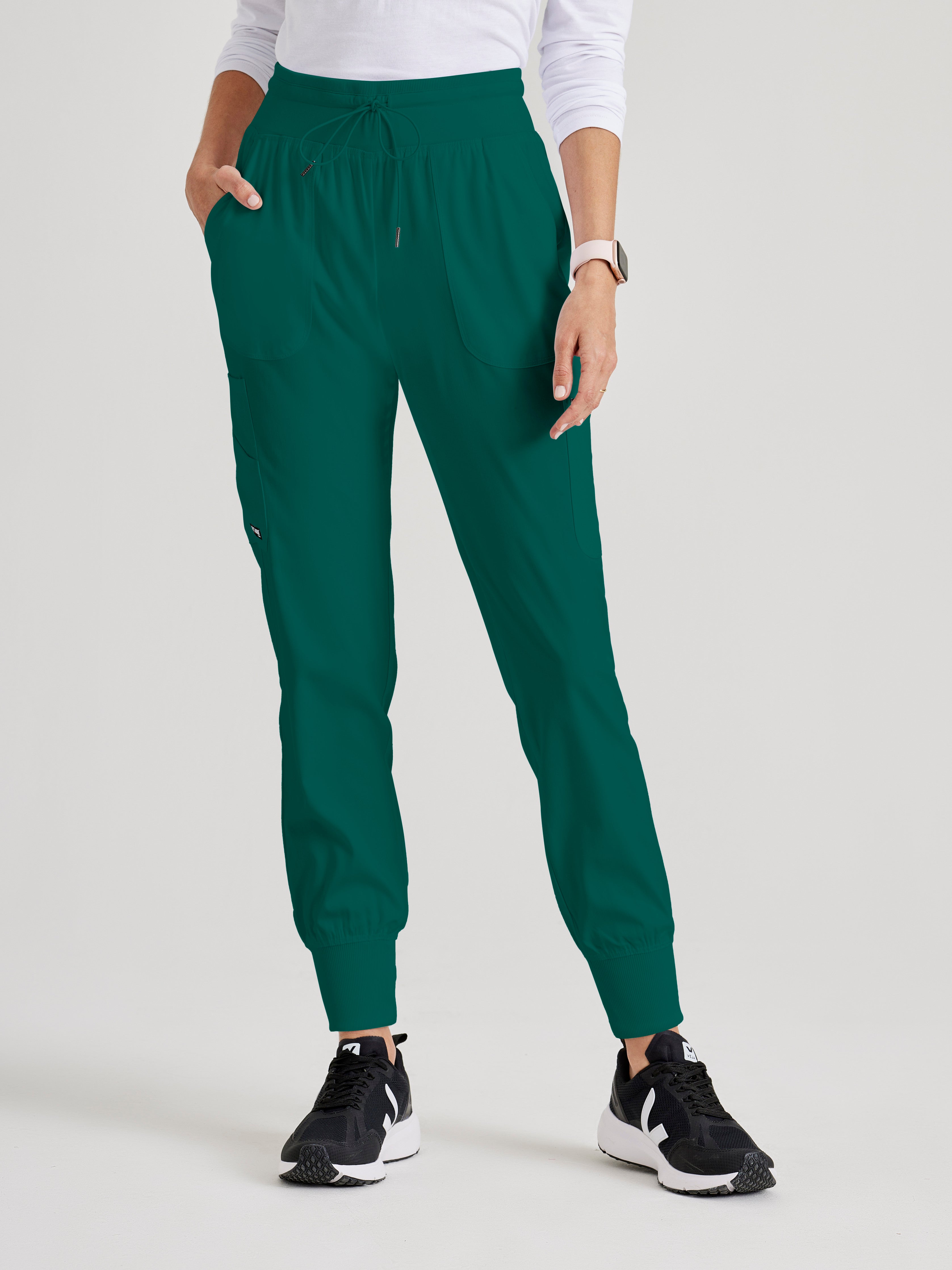 Front View of the Carly 7-Pocket Mid-Rise Jogger Scrub Pant in Hunter Green from Grey's Anatomy™ by Barco Spandex Stretch