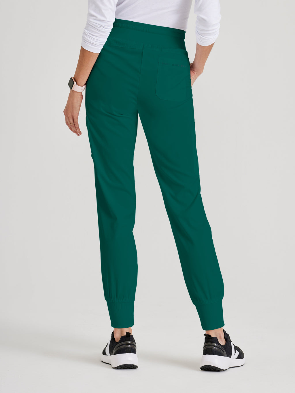 Side View of the Carly 7-Pocket Mid-Rise Jogger Scrub Pant in Hunter Green from Grey's Anatomy™ by Barco Spandex Stretch