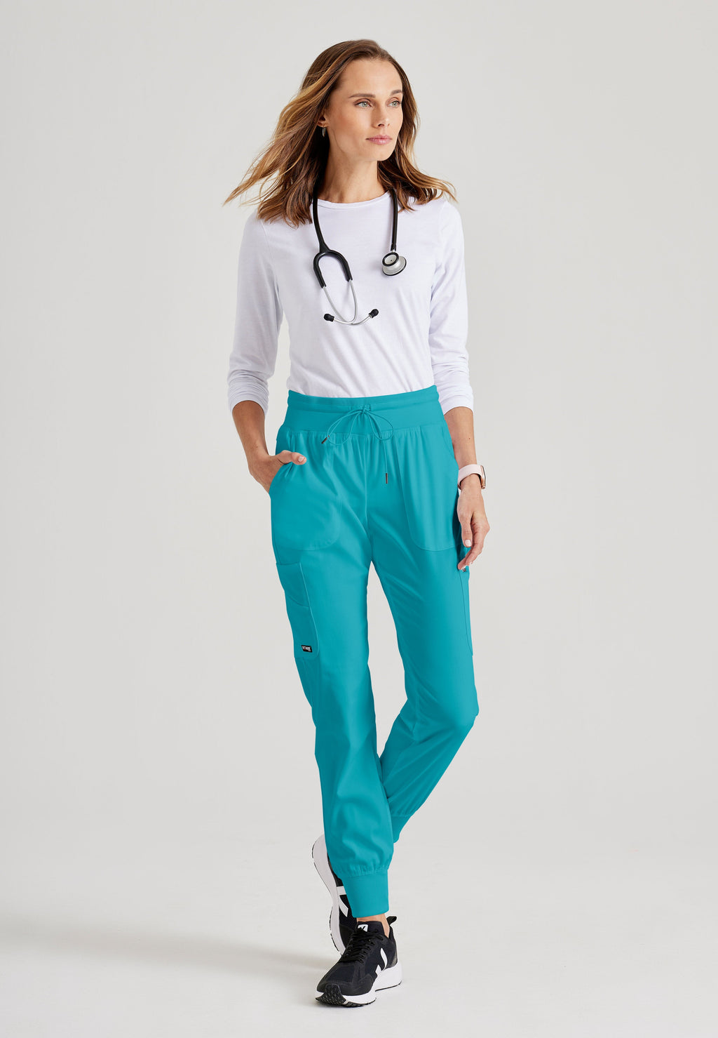 Grey's Anatomy Spandex-Stretch Women’s teal Double Cargo Jogger Scrub Pants with Elastic Waistband. 7 pockets with ribbed waistband and cuffs.