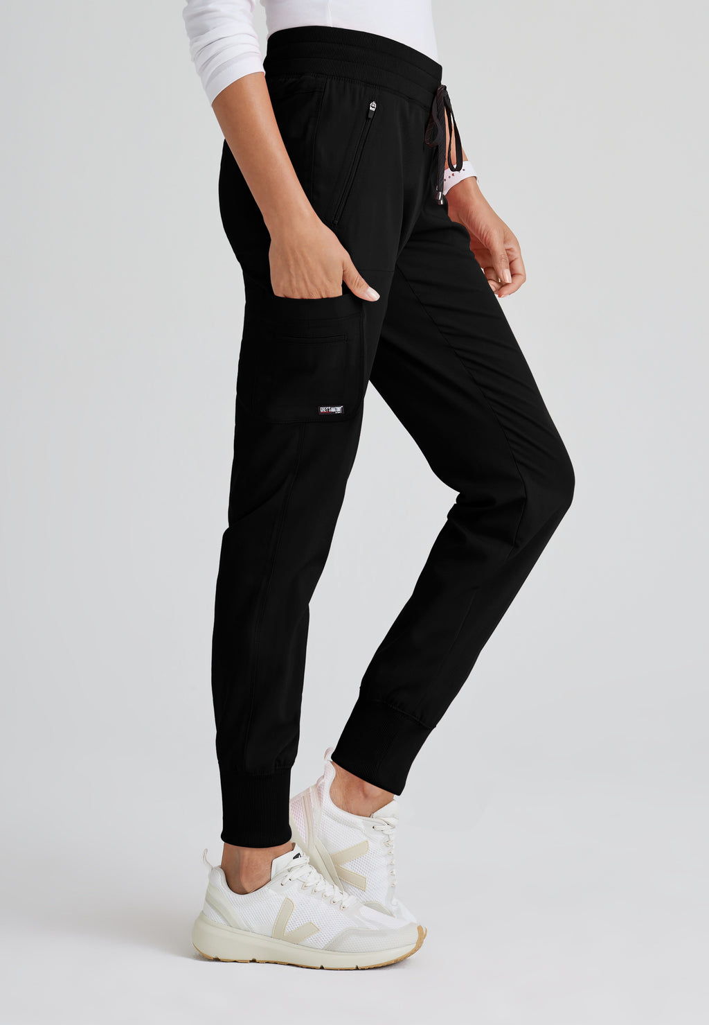Side View of the Eden 5-Pocket Mid-Rise Jogger Scrub Pant in Black from Grey's Anatomy™ by Barco Spandex Stretch