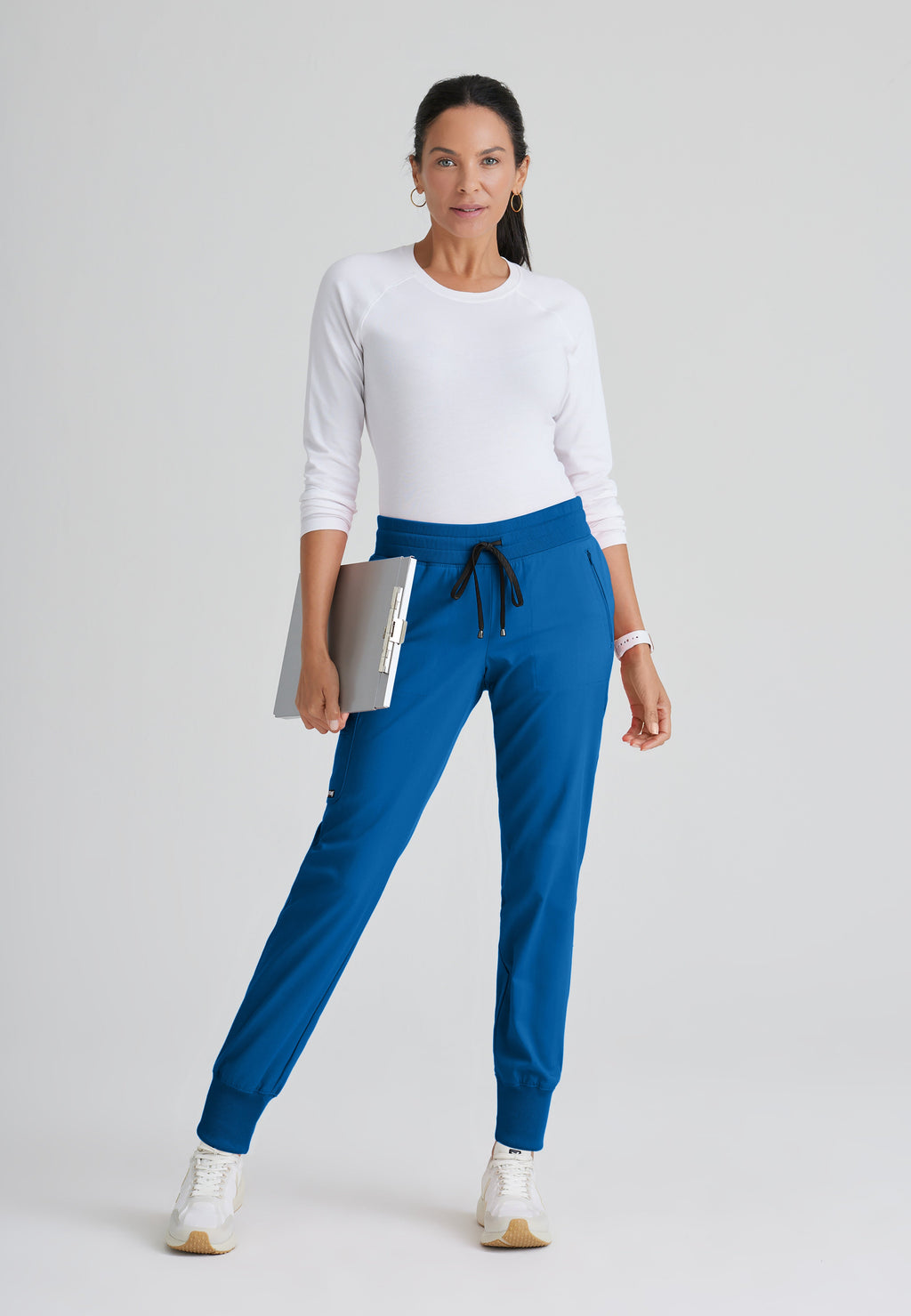 Full Body View of the Eden 5-Pocket Mid-Rise Jogger Scrub Pant in New Royal from Grey's Anatomy™ by Barco Spandex Stretch