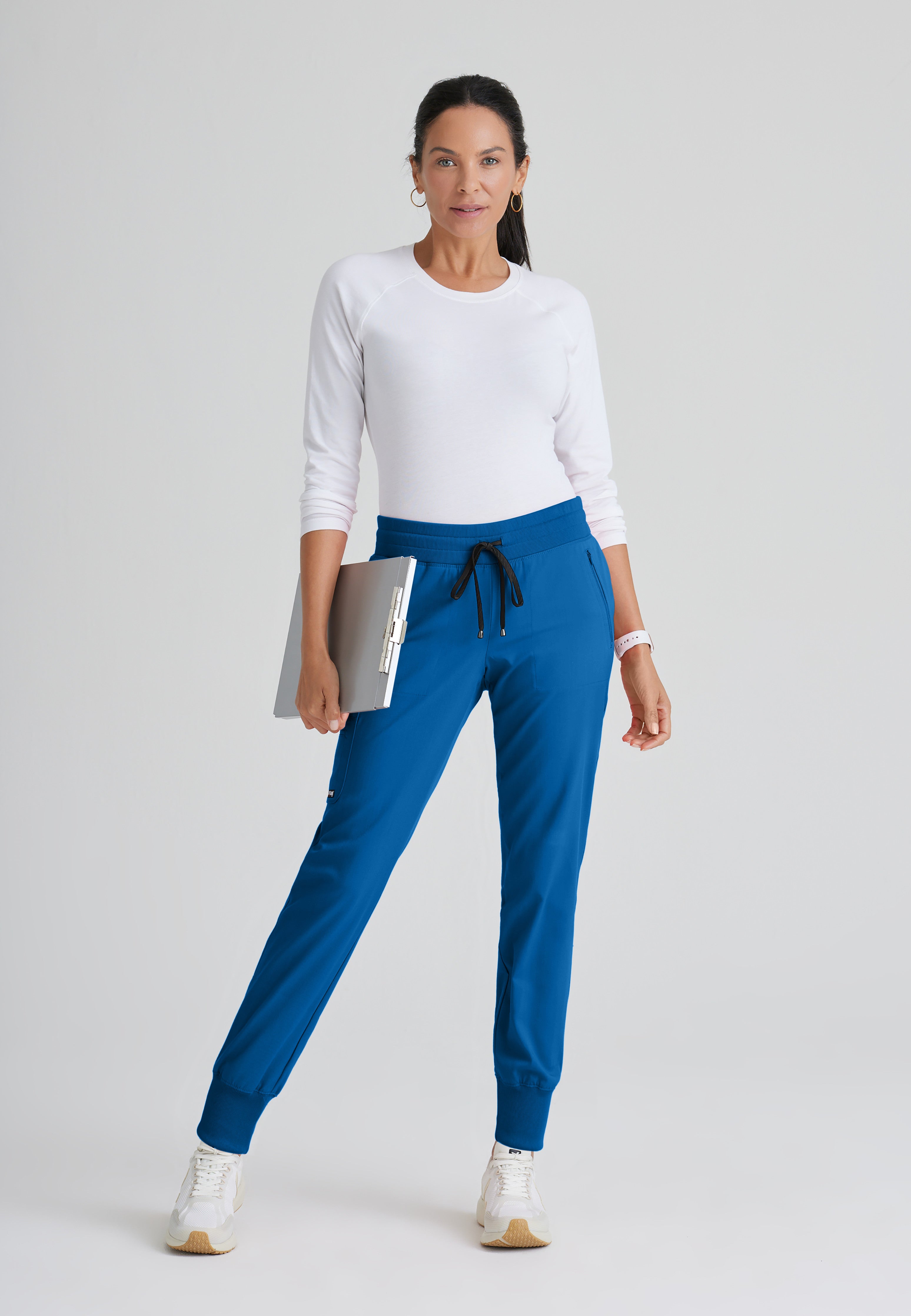 Full Body View of the Eden 5-Pocket Mid-Rise Jogger Scrub Pant in New Royal from Grey's Anatomy™ by Barco Spandex Stretch
