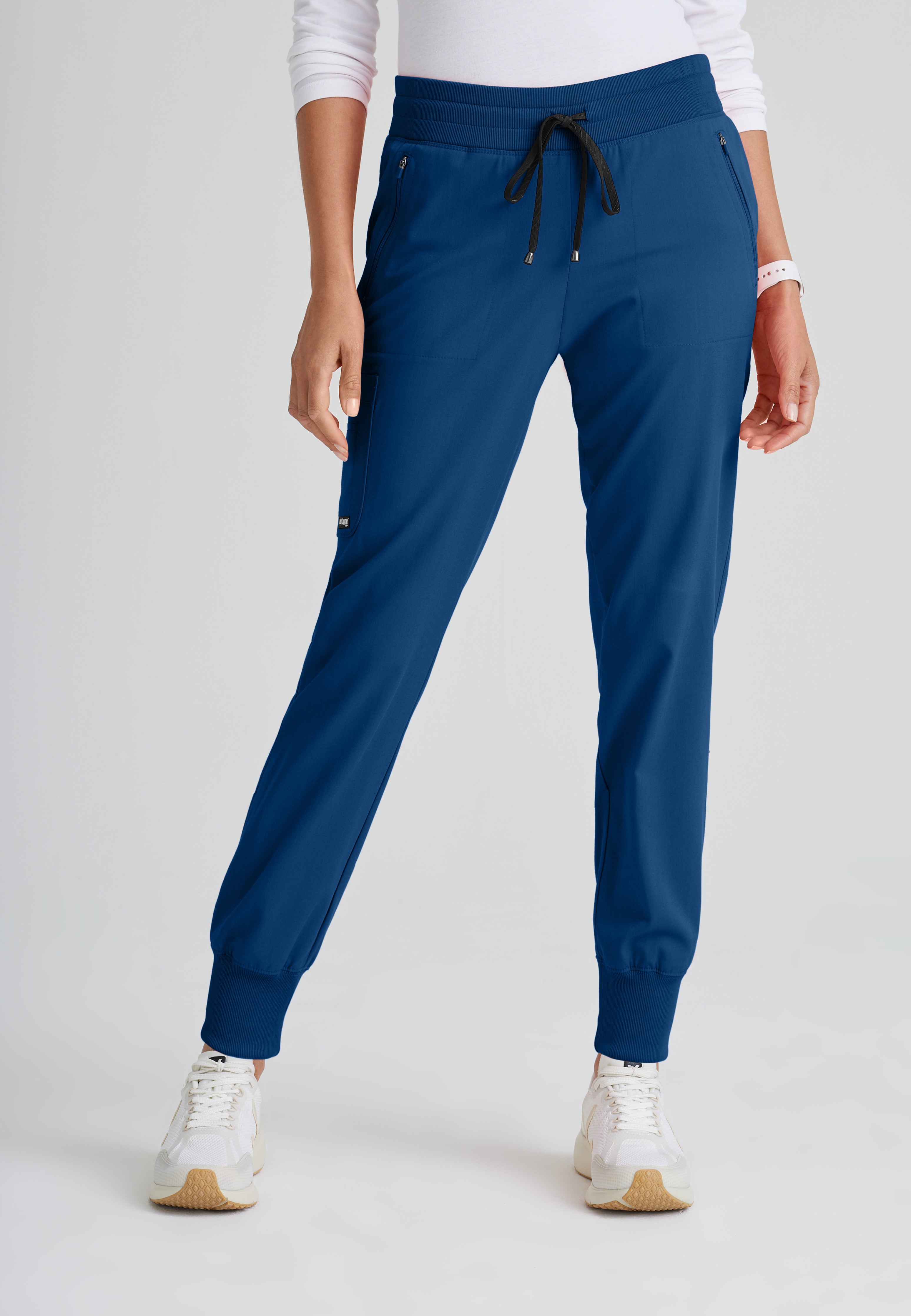 Front View of the Eden 5-Pocket Mid-Rise Jogger Scrub Pant in Indigo from Grey's Anatomy™ by Barco Spandex Stretch