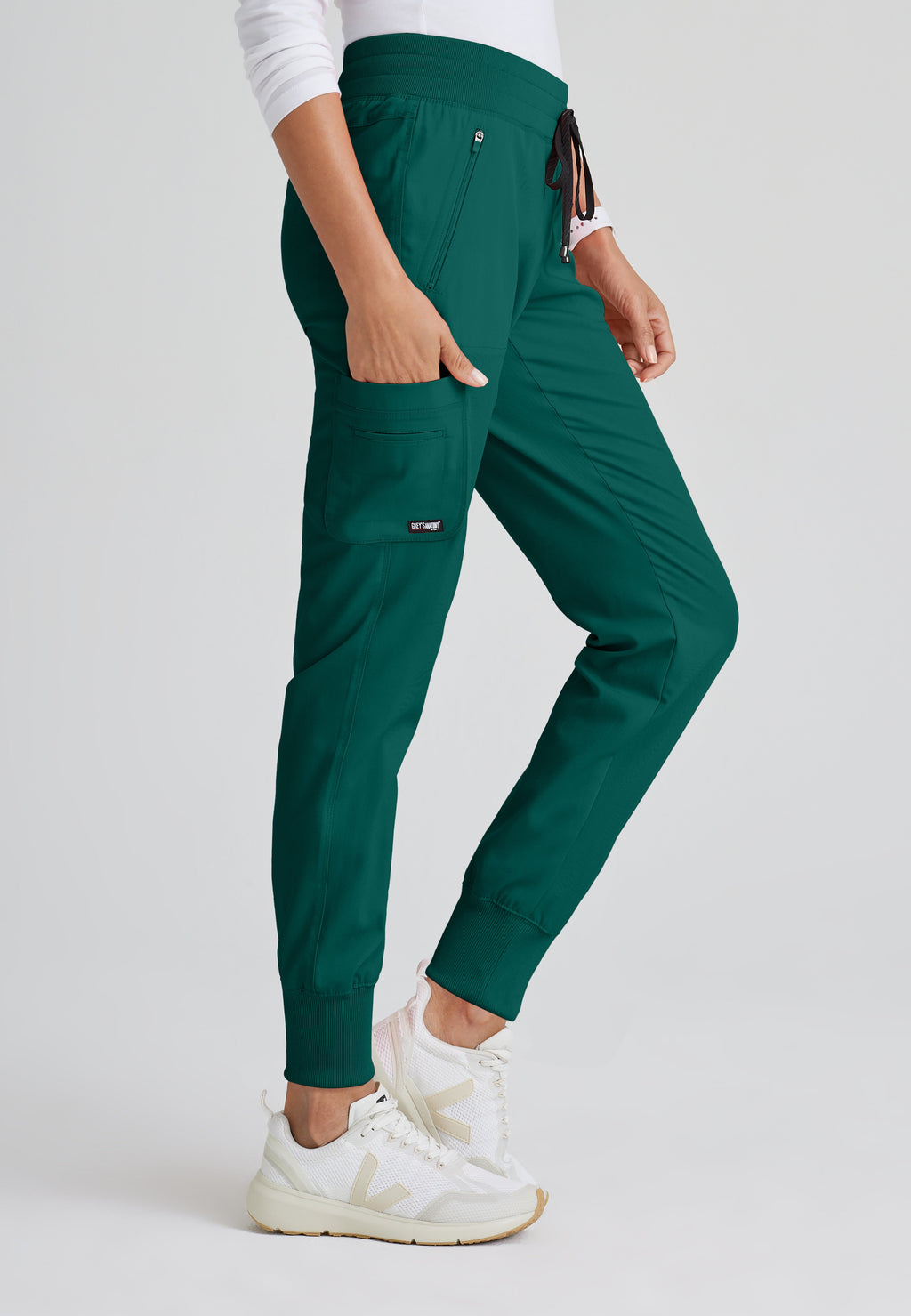 Side View of the Eden 5-Pocket Mid-Rise Jogger Scrub Pant in Hunter Green from Grey's Anatomy™ by Barco Spandex Stretch