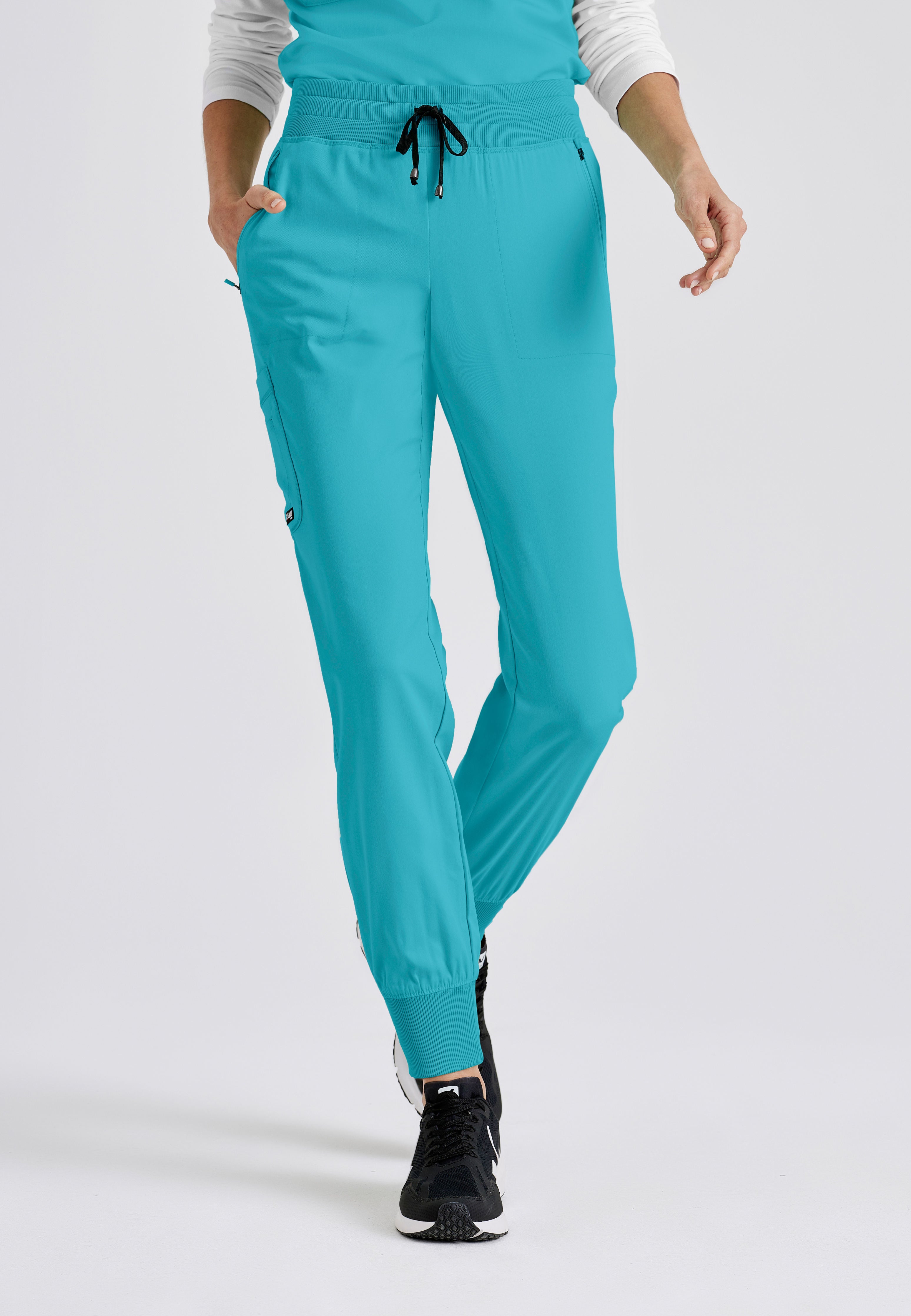 Grey's Anatomy Spandex-Stretch women's teal jogger scrub pants. Rib waist and cuffs. 5 pockets. Moisture-wicking stretch fabric.