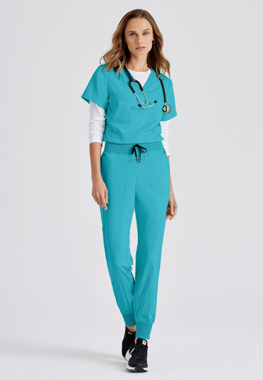Grey's Anatomy Spandex-Stretch women's teal jogger scrub pants. Rib waist and cuffs. 5 pockets. Moisture-wicking stretch fabric.
