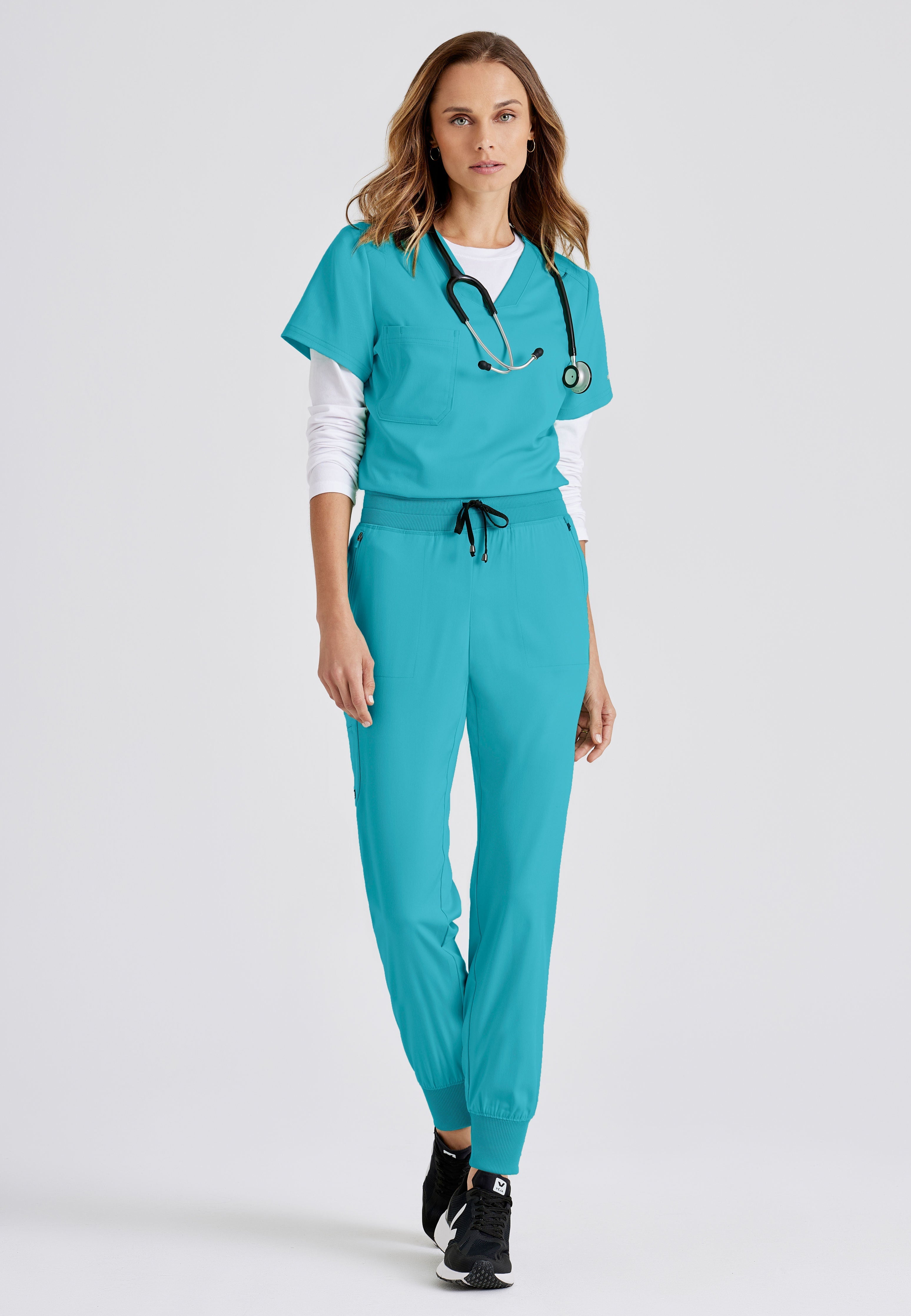 Grey's Anatomy Spandex-Stretch women's teal jogger scrub pants. Rib waist and cuffs. 5 pockets. Moisture-wicking stretch fabric.