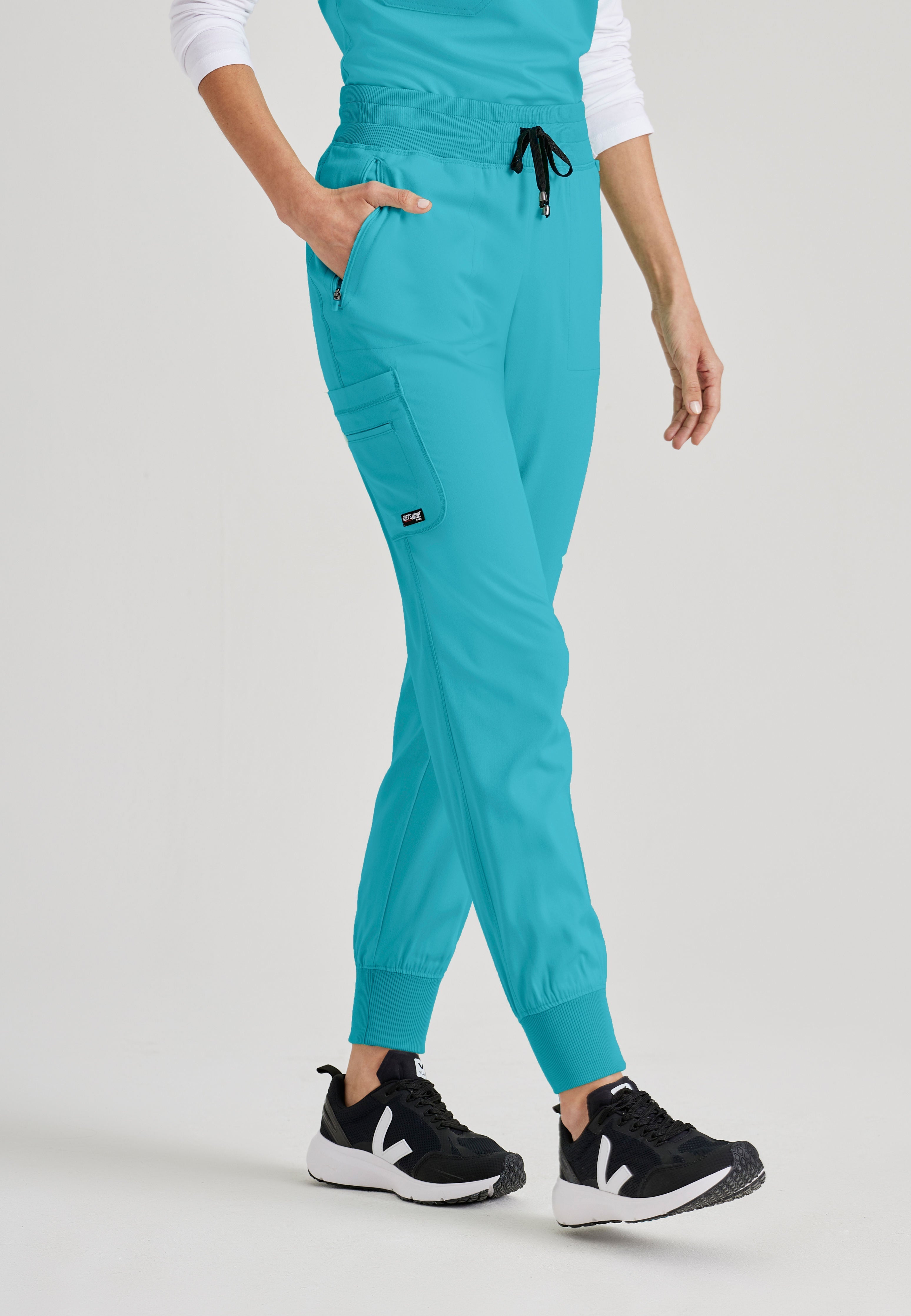 Grey's Anatomy Spandex-Stretch women's teal jogger scrub pants. Rib waist and cuffs. 5 pockets. Moisture-wicking stretch fabric.