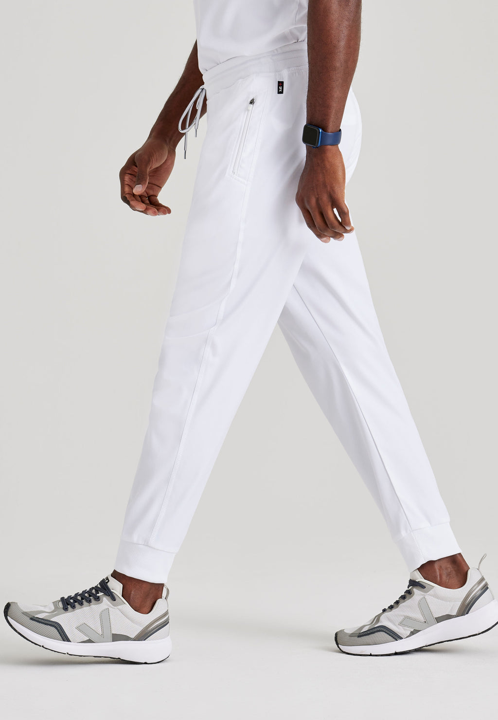 Grey's Anatomy Spandex-Stretch Men’s white Zip-Fly 5-Pocket Jogger Scrub Pant. Elastic waistband with drawstring. Wrinkle-resistant, easy care fabric. 