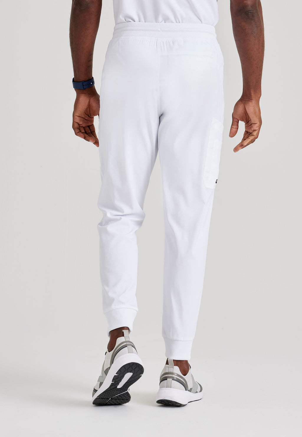 Grey's Anatomy Spandex-Stretch Men’s white Zip-Fly 5-Pocket Jogger Scrub Pant. Elastic waistband with drawstring. Wrinkle-resistant, easy care fabric. 