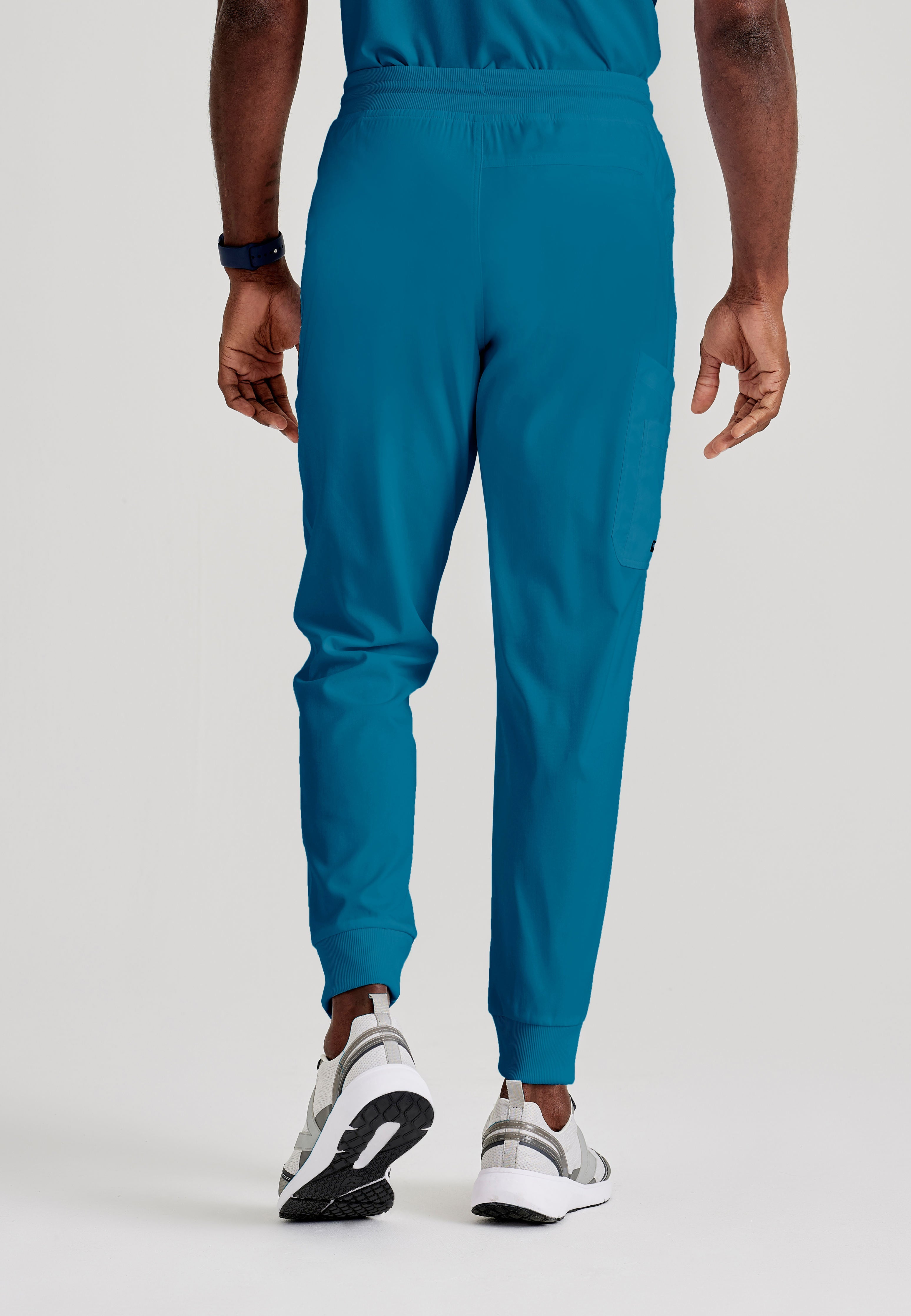 Grey's Anatomy Spandex-Stretch Men’s Bahama Zip-Fly 5-Pocket Jogger Scrub Pant. Elastic waistband with drawstring. Wrinkle-resistant, easy care fabric. 