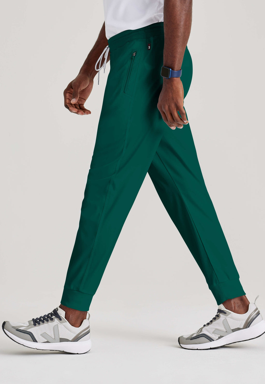 Grey's Anatomy Spandex-Stretch Men’s hunter Zip-Fly 5-Pocket Jogger Scrub Pant. Elastic waistband with drawstring. Wrinkle-resistant, easy care fabric. 