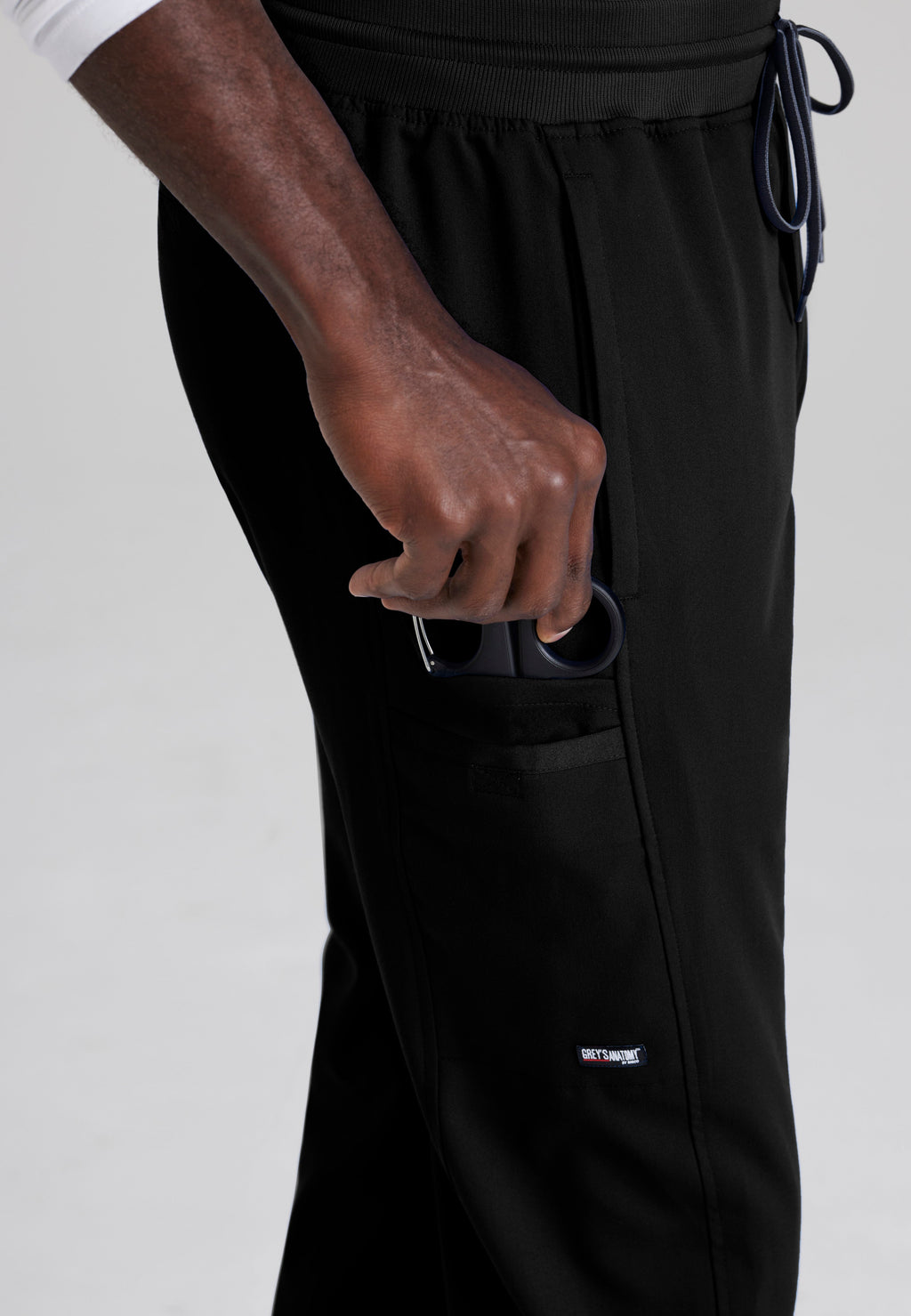 Detail Shot of the Hudson Straight Leg Drawcord Pant in Black from Grey's Anatomy™ by Barco Spandex Stretch