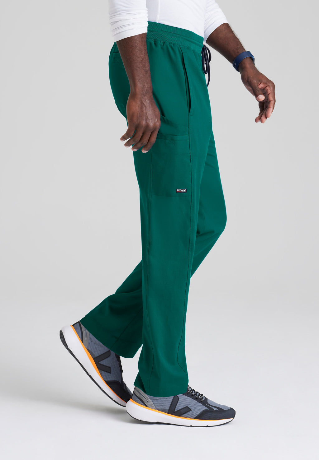 Side View of the Hudson Straight Leg Drawcord Pant in Hunter Green from Grey's Anatomy™ by Barco Spandex Stretch