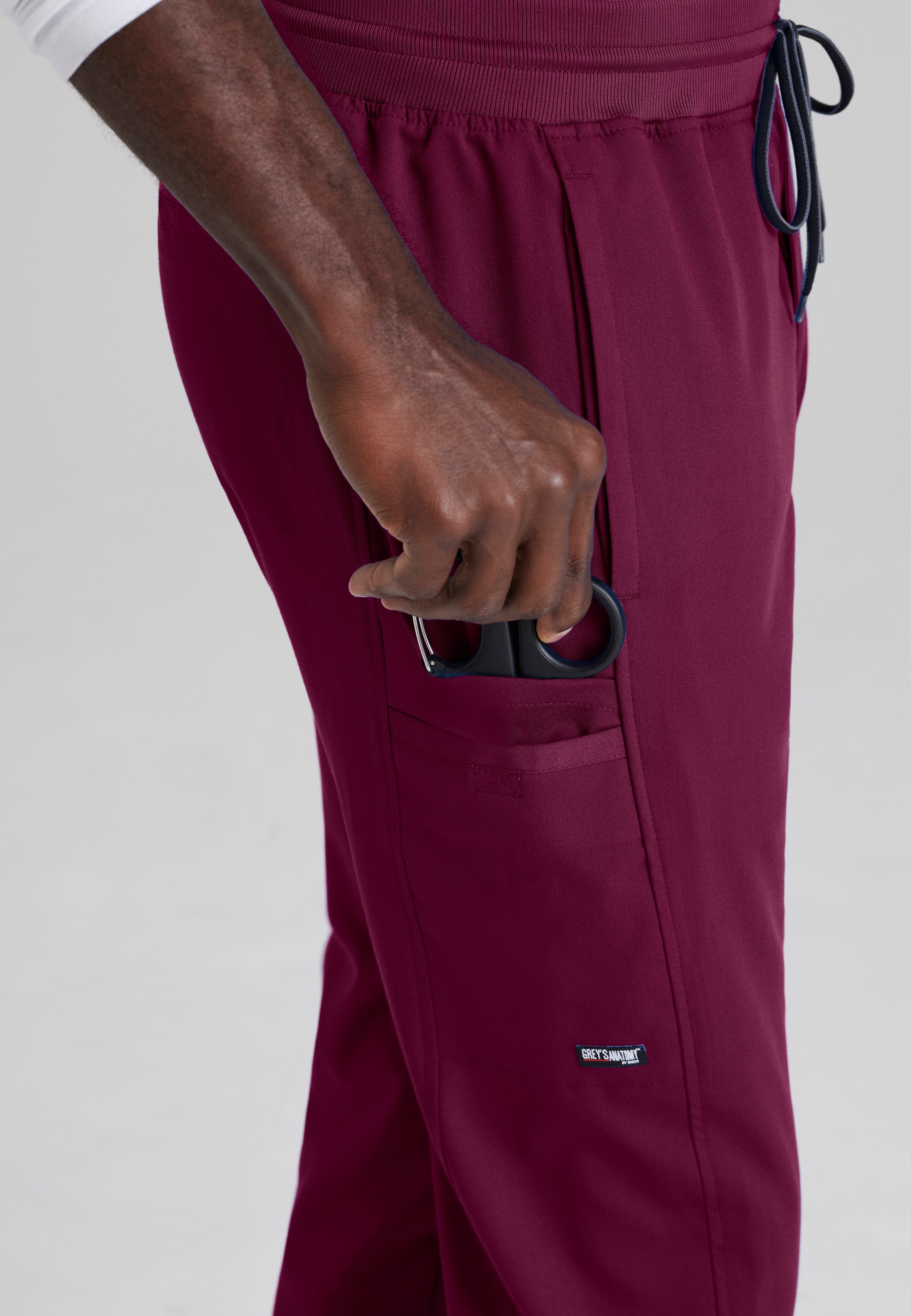 Detail Shot of the Hudson Straight Leg Drawcord Pant in Wine from Grey's Anatomy™ by Barco Spandex Stretch