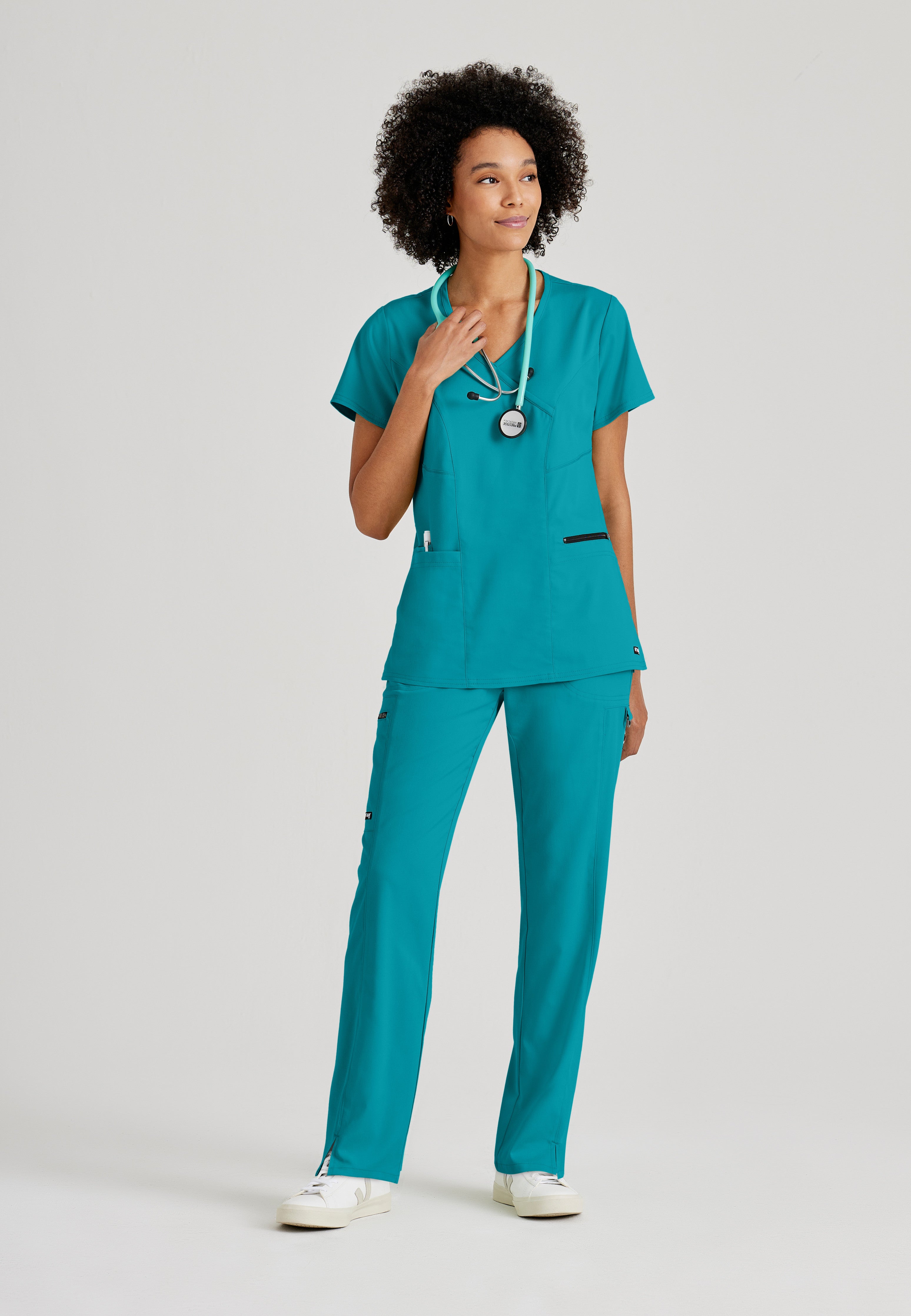 Full Body View of the Kim 3-Pocket Crossover V-Neck Scrub Top in Teal from Grey's Anatomy™ by Barco Spandex Stretch