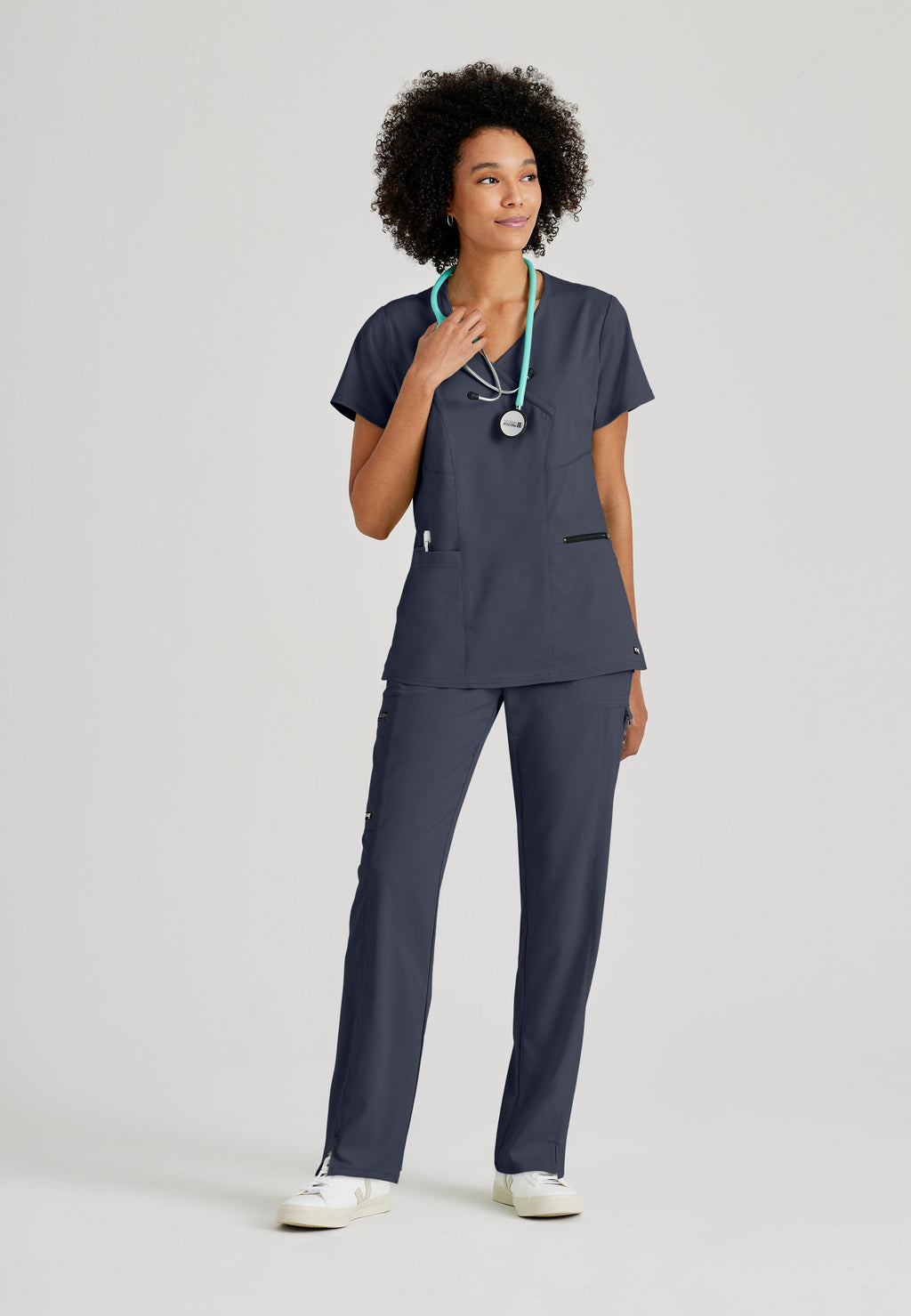Full Body View of the Kim 3-Pocket Crossover V-Neck Scrub Top in Steel from Grey's Anatomy™ by Barco Spandex Stretch