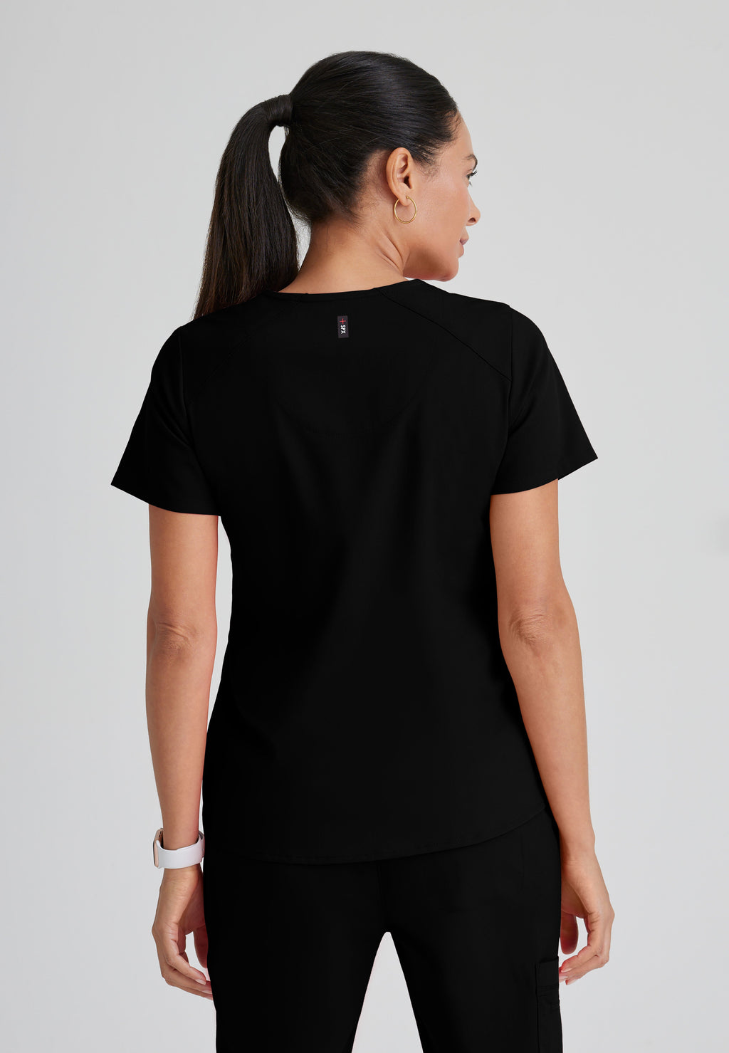 Back View of the Emma 4-Pocket V-Neck Scrub Top in Black from Grey's Anatomy™ by Barco Spandex Stretch