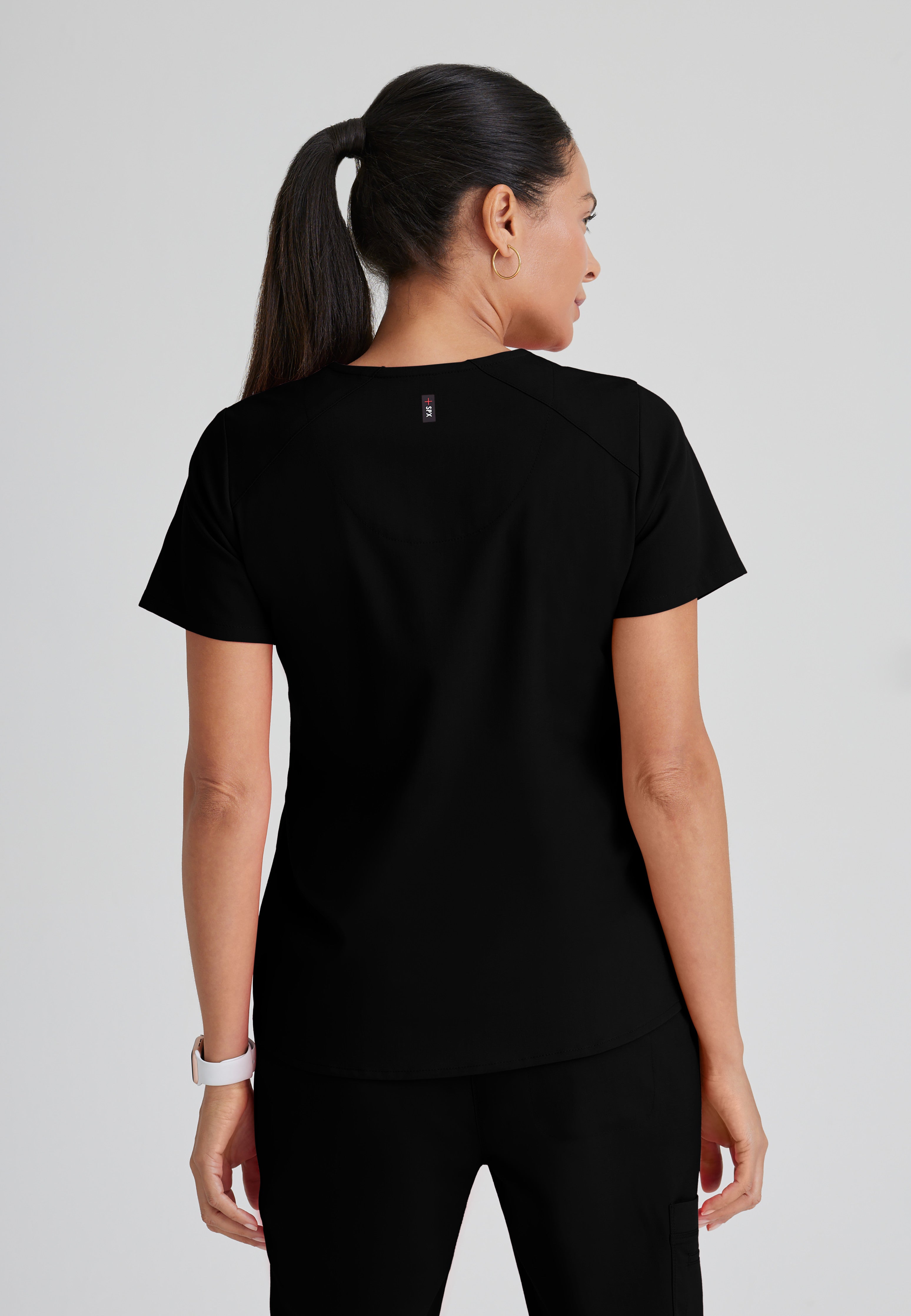 Back View of the Emma 4-Pocket V-Neck Scrub Top in Black from Grey's Anatomy™ by Barco Spandex Stretch