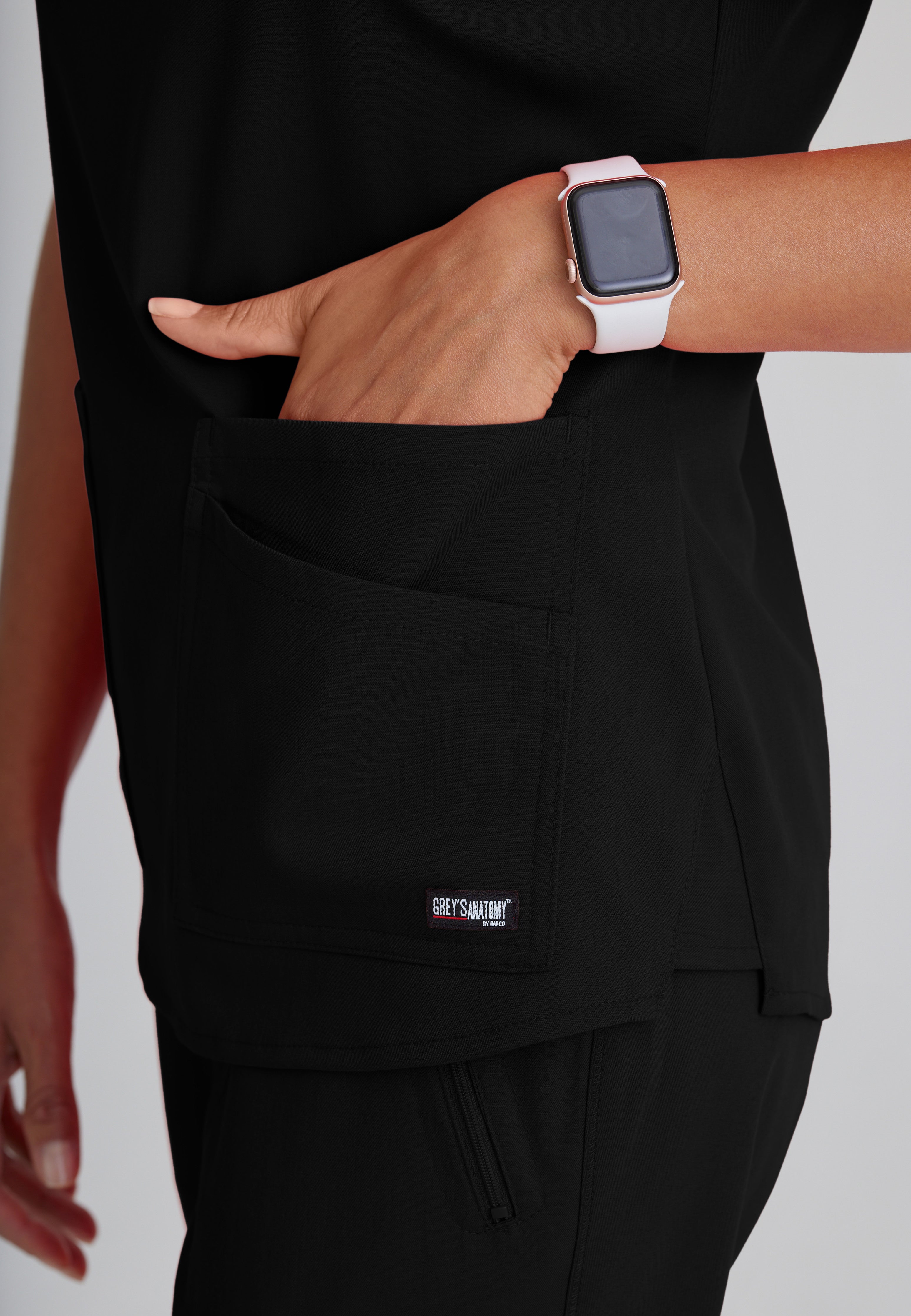 Detail Shot of the Emma 4-Pocket V-Neck Scrub Top in Black from Grey's Anatomy™ by Barco Spandex Stretch